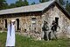 Army Sgt. Kaleb Paulsen, 1742nd Transportation Company, portrayed the village elder during an urban patrol exercise at Camp Rapid, August 3, 2015.  Paulsen pleaded with Security forces members Air Force Senior Airman Makayla McConnell and Tech. Sgt. Adam Smith as they attempted to secure and defend a small village from a simulated enemy attack. (National Guard photo by Tech. Sgt. Christopher Stewart)