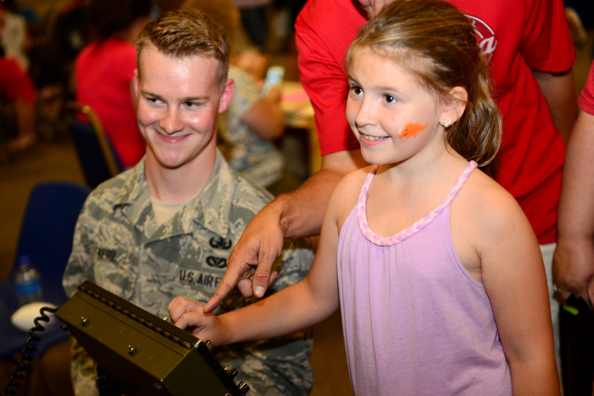 A young girl controls an explosive ordnance disposal robot during National Night Out at Barksdale Air Force Base, La., Aug. 4, 2015. EOD personnel from 2nd Civil Engineer Squadron specialize in the disarmament and disposal of explosives both locally and overseas. (U.S. Air Force photo/Airman 1st Class Luke Hill)