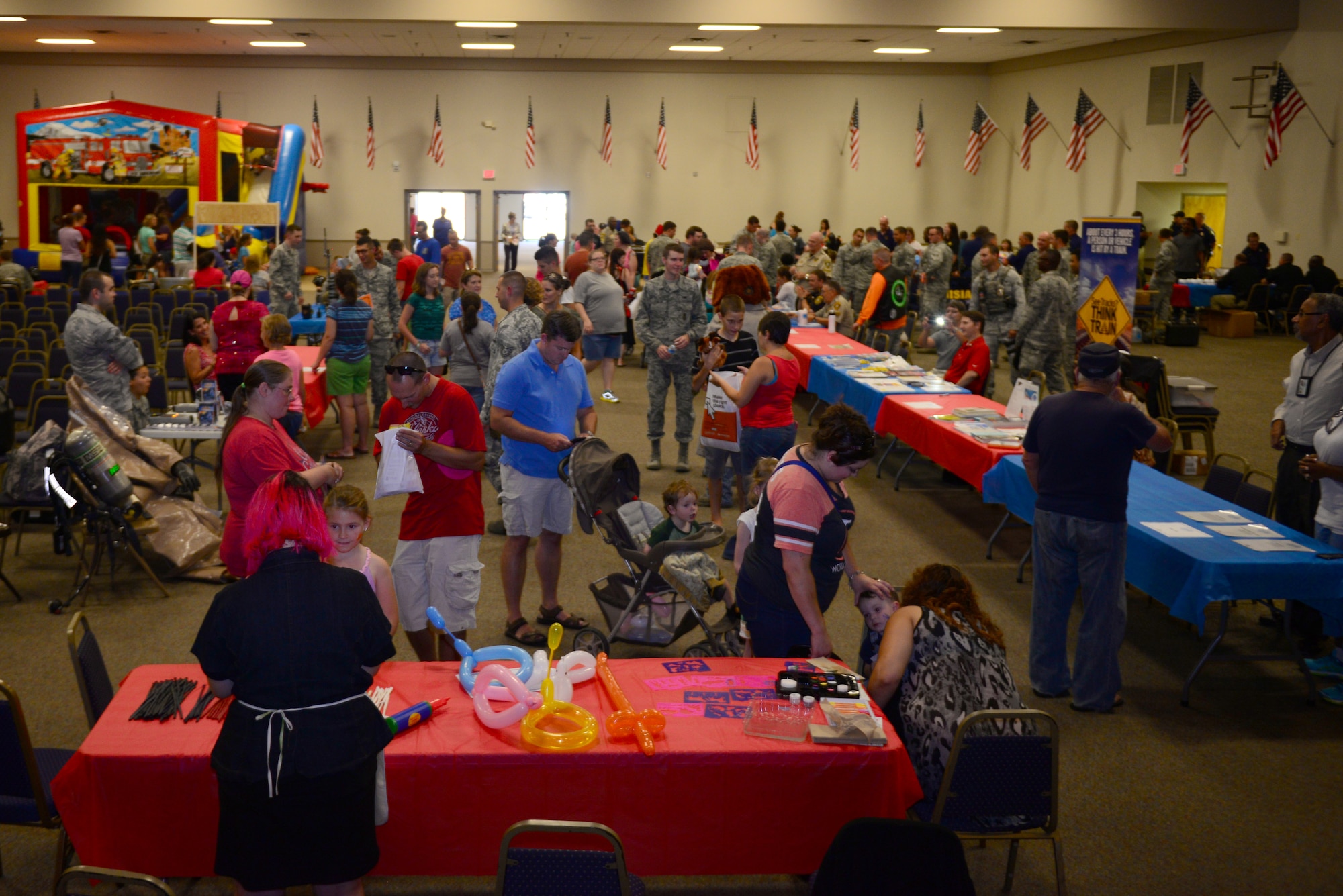 Team Barksdale and local community members enjoy food and entertainment during National Night Out at Barksdale Air Force Base, La., Aug. 4, 2015. National Night Out is an opportunity for base organizations and local law enforcement to bring the community together to raise awareness in crime and drug prevention. (U.S. Air Force photo/Airman 1st Class Luke Hill)