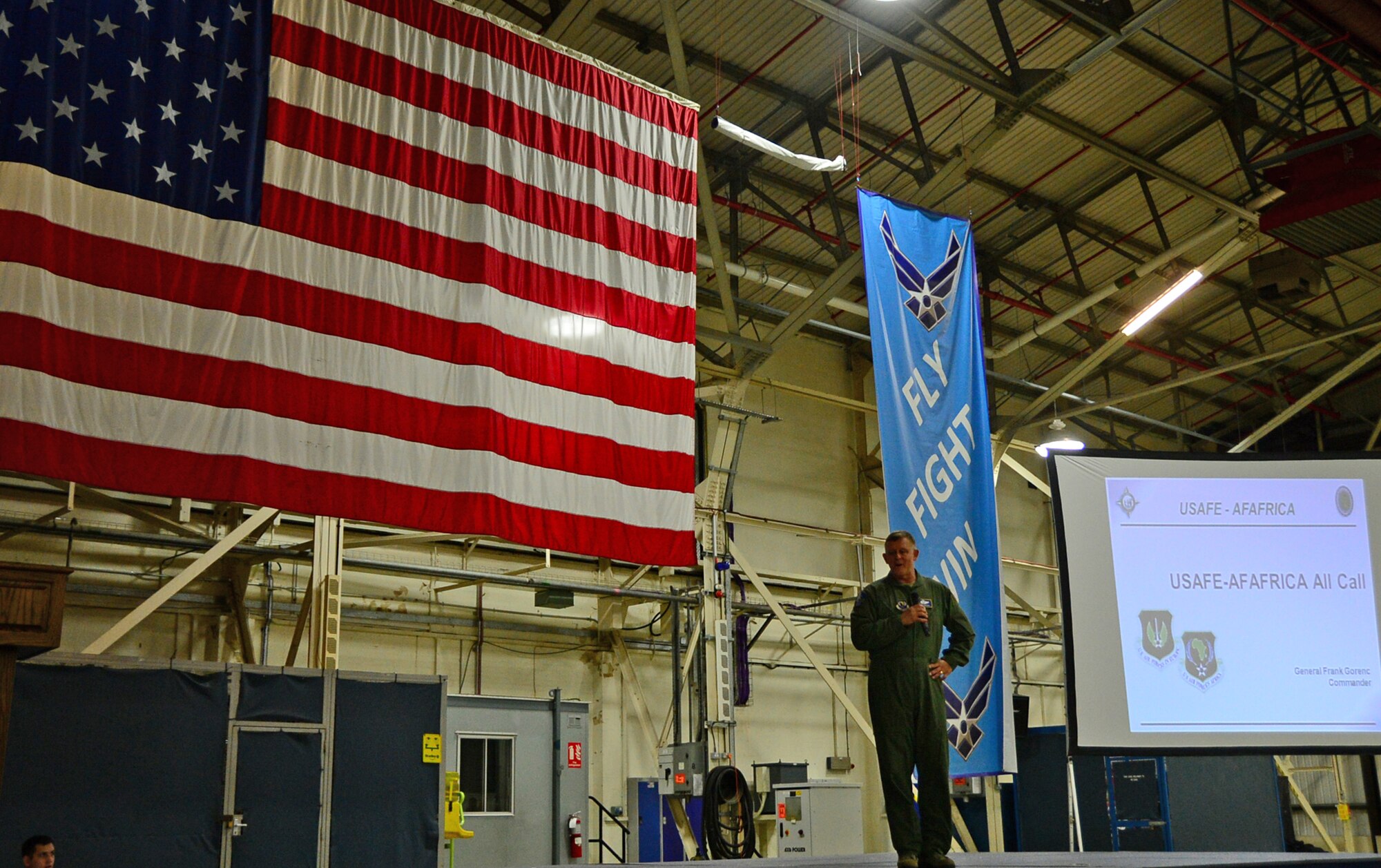 Gen. Frank Gorenc, U.S. Air Forces in Europe and Air Forces Africa commander, speaks to Airmen during a commanders call at Royal Air Force Lakenheath, England, Aug. 6, 2015. Gorenc discussed key Air Force topics such as force management, budget constraints and Air Force challenges, and answered questions from Liberty Airmen. (U.S Air Force photo by Senior Airman Erin O’Shea/Released) 