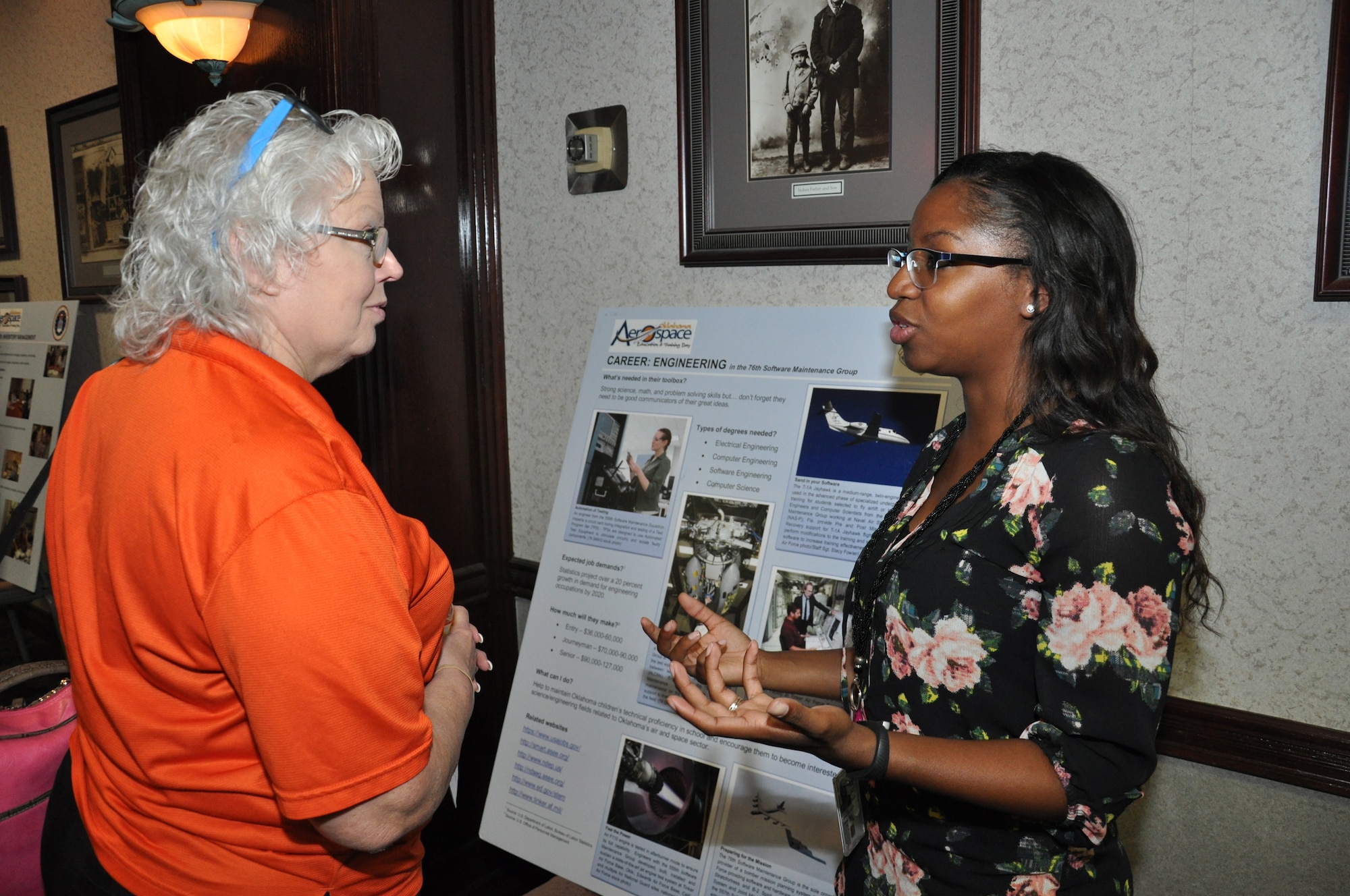 Gabby Cooley-Mankins, 76th Software Maintenance Group electrical engineer, right, provides Barbara Bloyed, gateway instructor for Project Lead The Way at Harrah’s Middle School, a brief overview of the Science, Technology, Engineering and Math, or STEM, opportunities at the Oklahoma City Air Logistics Complex. Ms. Cooley-Mankins said in eighth grade she was inspired through STEM to pursue her interests, leading to her electrical engineering degree from the University of Oklahoma. Subsequently, it was her STEM interests that opened the door for a profession working with teams of engineers and subject matter experts who directly support Air Force readiness and development.  (Air Force photo by Brion Ockenfels/Released)
