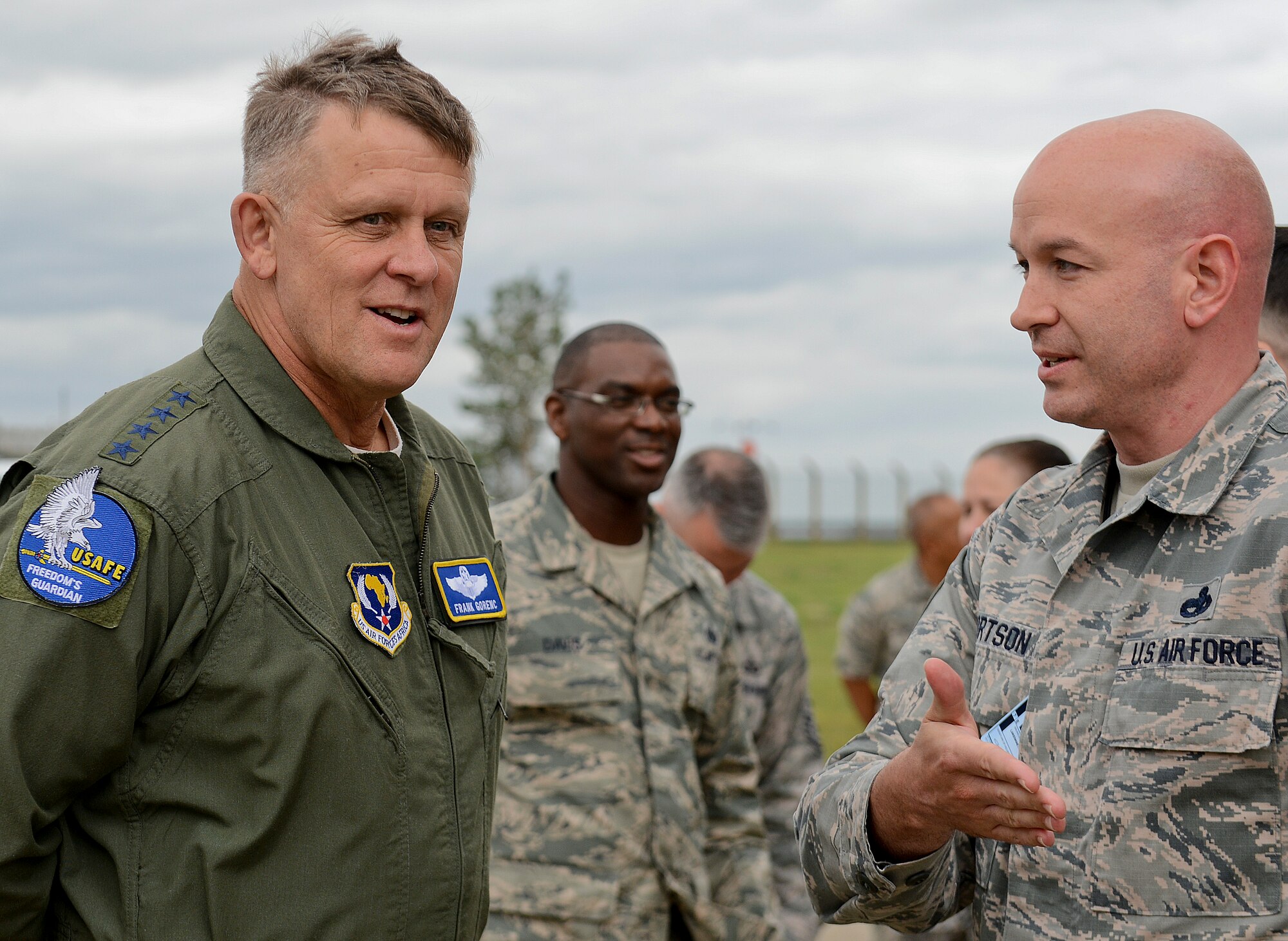 Gen. Frank Gorenc, U.S. Air Forces in Europe and Air Forces Africa commander, speaks with Airmen from the 48th Aircraft Maintenance Squadron during a distinguished guest visit at Royal Air Force Lakenheath, England, Aug. 4, 2015. Gorenc recognized exceptional Airman for their accomplishments within the Liberty Wing and discussed key topics within the Air Force. (U.S. Air Force photo by Senior Airman Trevor T. McBride/Released)