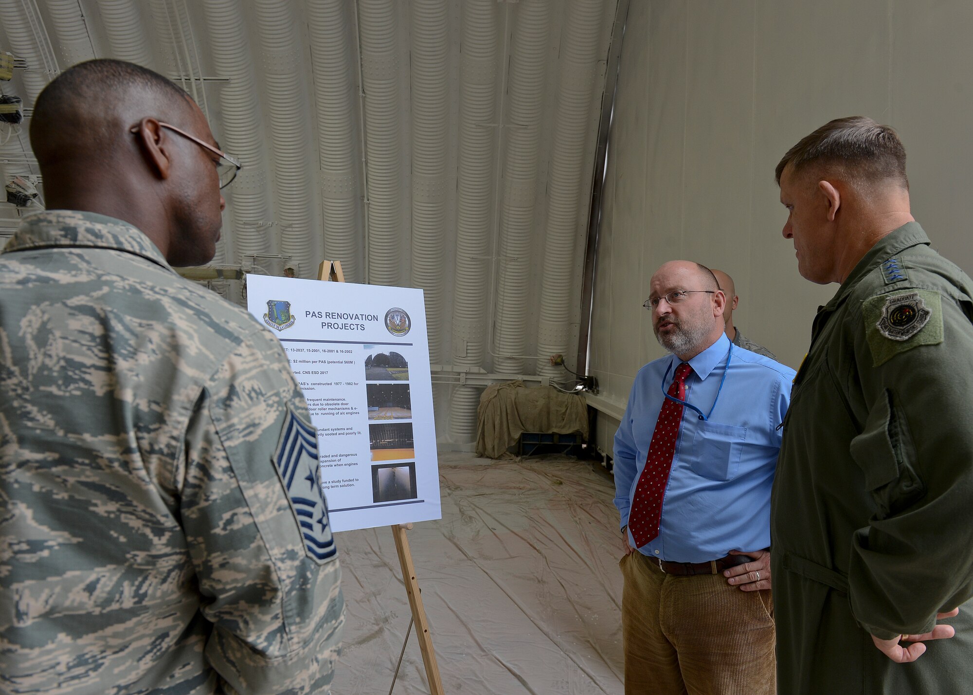 Gen. Frank Gorenc, U.S. Air Forces in Europe and Air Forces Africa commander, discusses Protective Aircraft Shelter projects for the Liberty Wing during a distinguished guest visit at Royal Air Force Lakenheath, England, Aug. 4, 2015. Gorenc recognized exceptional Airmen for their accomplishments within the Liberty Wing and discussed key topics within the Air Force. (U.S. Air Force photo by Senior Airman Trevor T. McBride/Released)