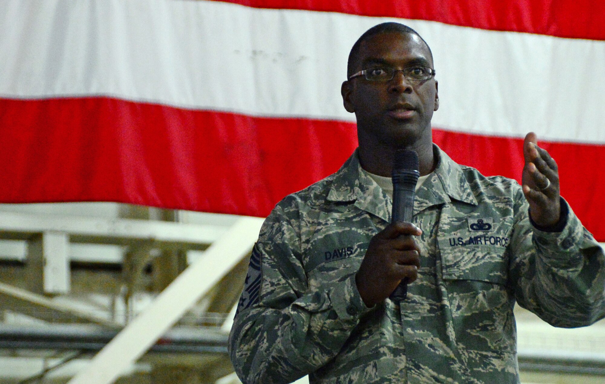 Chief Master Sgt. James E. Davis, USAFE-AFAFRICA command chief, answers questions from Airmen during a commander’s call at Royal Air Force Lakenheath, England, Aug. 6, 2015. Davis and Gen. Frank Gorenc, U.S. Air Forces in Europe and Air Forces Africa commander, recognized exceptional Airmen and discussed key Air Force topics during their visit. (U.S. Air Force photo by Senior Airman Erin O’Shea/Released) 