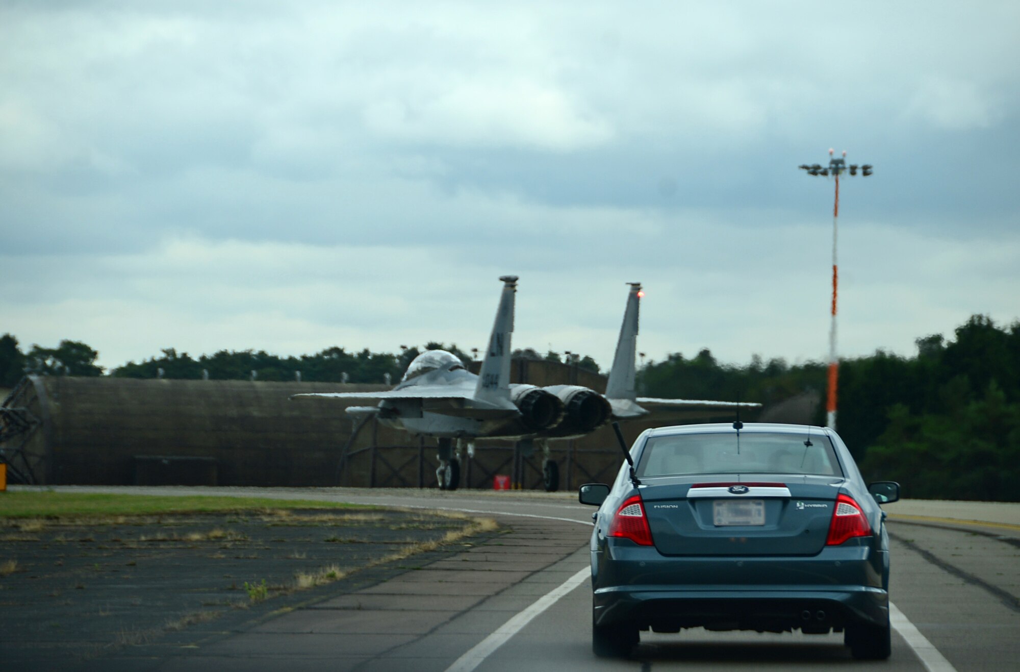 A 493rd Fighter Squadron F-15D Eagle co-piloted by Gen. Frank Gorenc, U.S. Air Forces in Europe and Air Forces Africa commander, taxis down the runway followed by the 48th Fighter Wing commander, Col. Robert Novotny, at Royal Air Force Lakenheath, England, Aug. 6, 2015. During his visit, Gorenc recognized exceptional Airmen and discussed key Air Force topics. (U.S. Air Force photo by Senior Airman Erin O’Shea/Released)