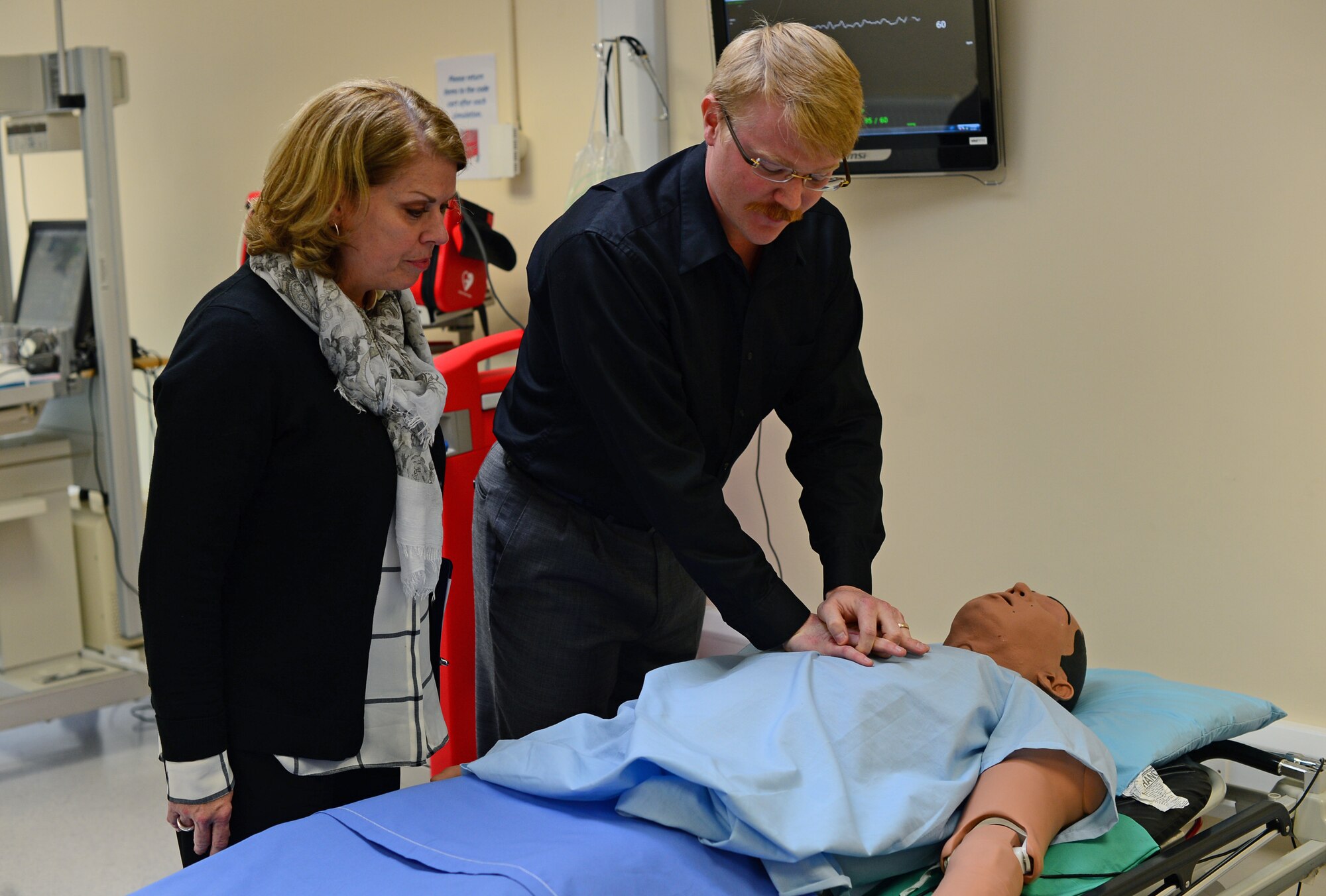 Sharon Gorenc, wife of Gen. Frank Gorenc, U.S. Air Forces in Europe and Air Forces Africa commander, observes a mannequin simulator demonstration at Royal Air Force Lakenheath, England, Aug. 4, 2015. Gorenc recognized exceptional Airmen and discussed key Air Force topics. (U.S. Air Force photo by Senior Airman Erin O’Shea/Released)