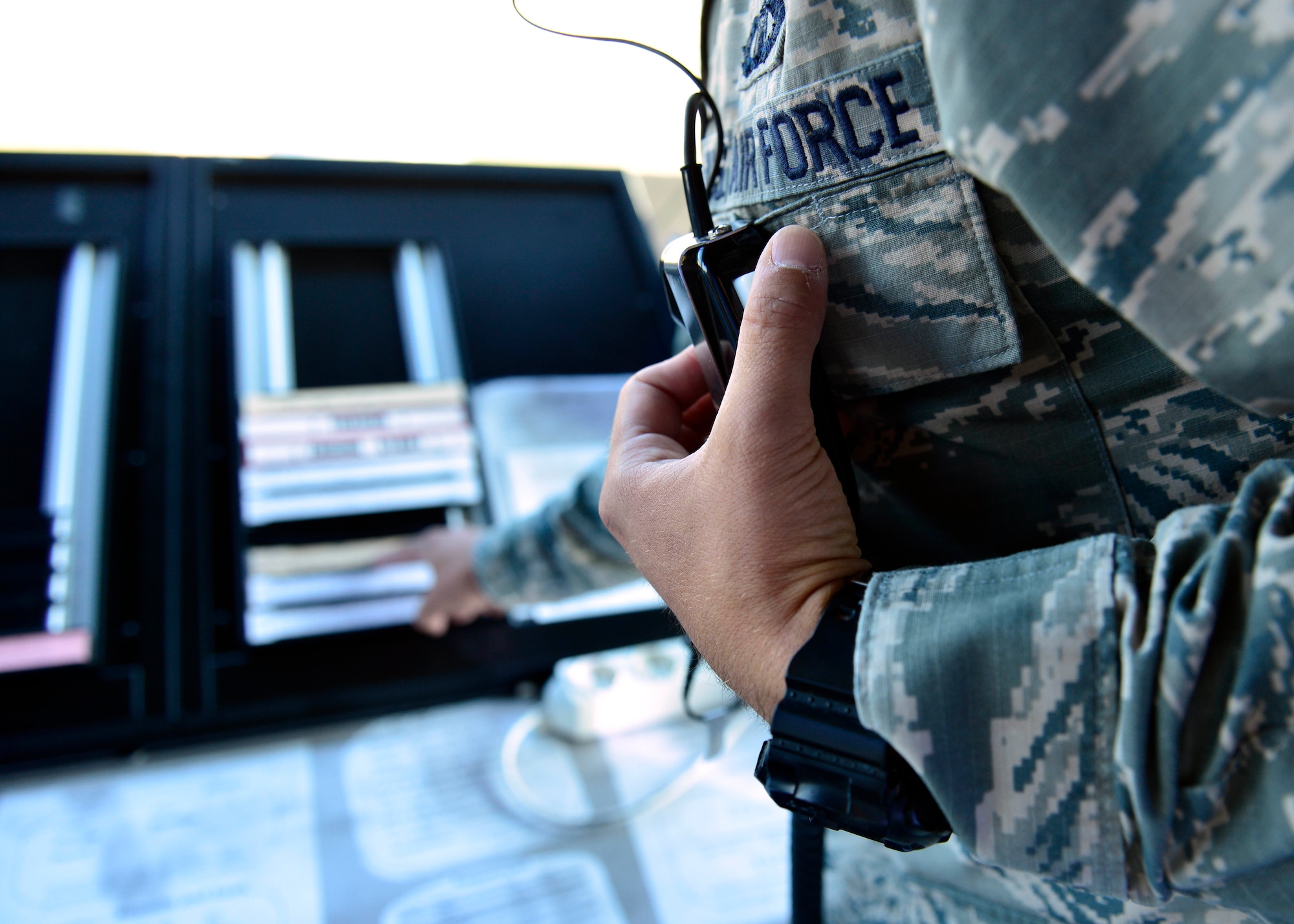 A U.S. Air Force air traffic control Airman calls a pilot for flight departure information, Aug. 5, 2015, at Aviano Air Base, Italy. Air traffic control is responsible for maintaining all flight information surrounding Aviano. (U.S. Air Force photo by Airman 1st Class Cary Smith/Released) 