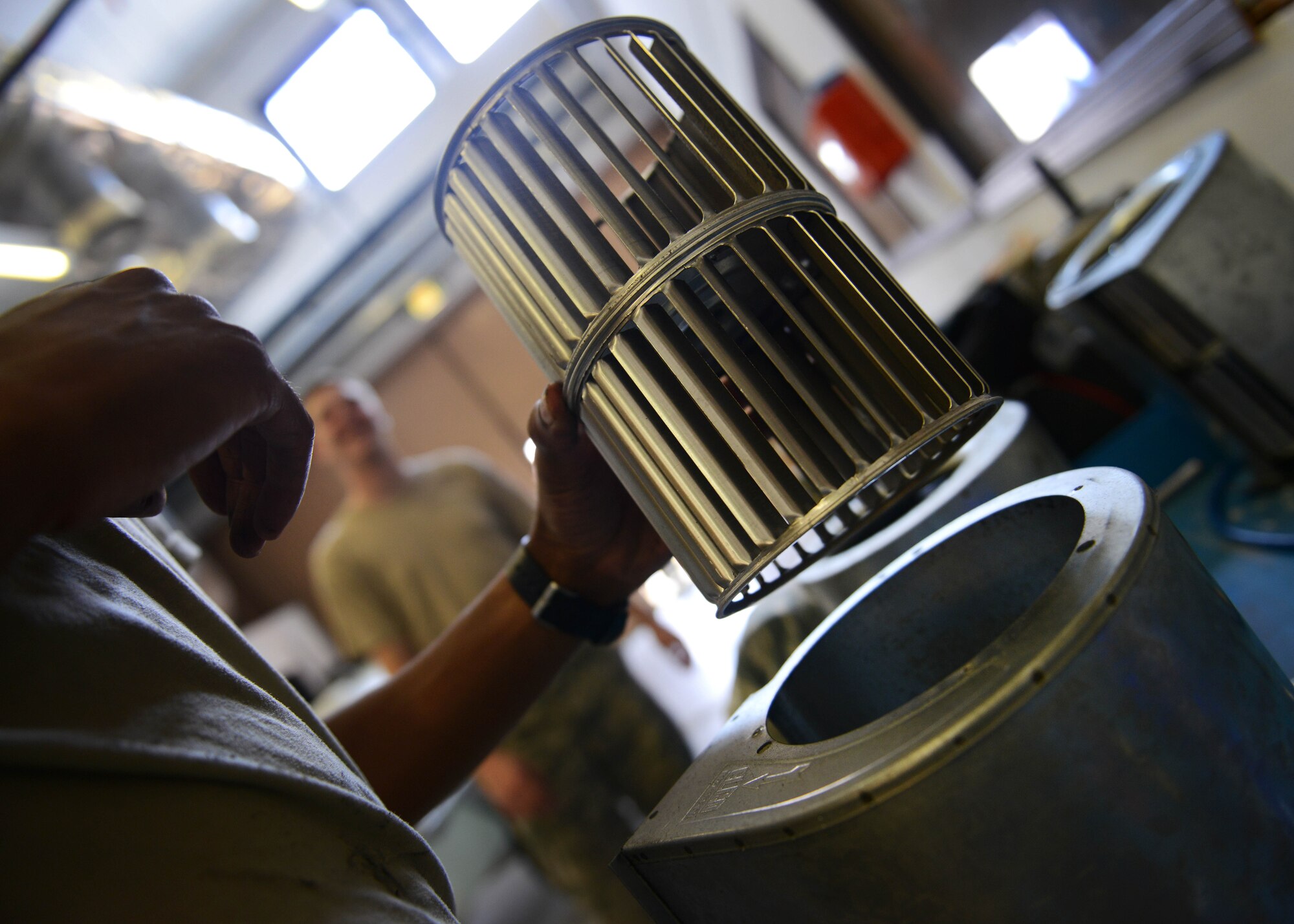 U.S. Air Force Airman 1st Class Jont’e Tate, 31st Civil Engineer Squadron heating, ventilation, air conditioning and refrigeration technician, disassembles a fan coil motor, July 29, 2015, at Aviano Air Base, Italy. The fan coil motor is used for controlling temperatures throughout different rooms in a building. (U.S. Air Force photo by Airman 1st Class Deana Heitzman/Released)