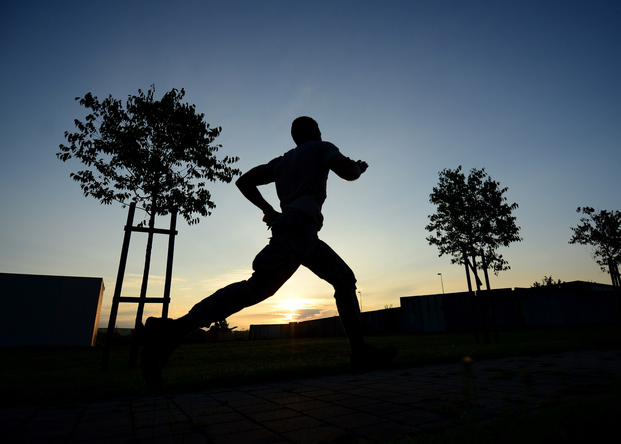 U.S. Air Force Airman 1st Class Ricardo Rios, 31st Security Forces Squadron defender, completes a 5-mile run during an Army pre-Ranger physical assessment, Aug. 5, 2015 at Aviano Air Base, Italy. Rios and several Aviano Airmen participated in the pre-Ranger course which included a 5-mile run, pushups, situps and chinups. (U.S. Air Force photo by Staff Sgt. Evelyn Chavez/Released)