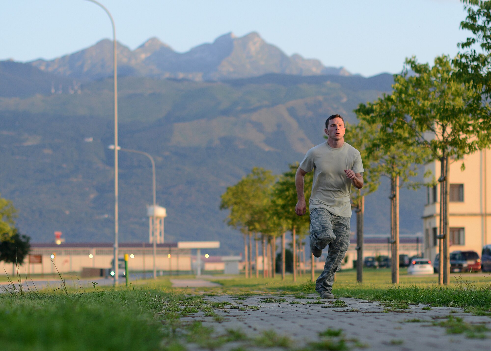 U.S. Air Force Staff Sgt. Kevin Belanger, 31st Security Forces Squadron defender, completes a 5-mile run during an Army pre-Ranger physical assessment, Aug. 5, 2015 at Aviano Air Base, Italy.  Belanger and several Aviano Airmen participated in the pre-Ranger course which included a 5-mile run, pushups, situps and chinups. (U.S. Air Force photo by Staff Sgt. Evelyn Chavez/Released)
