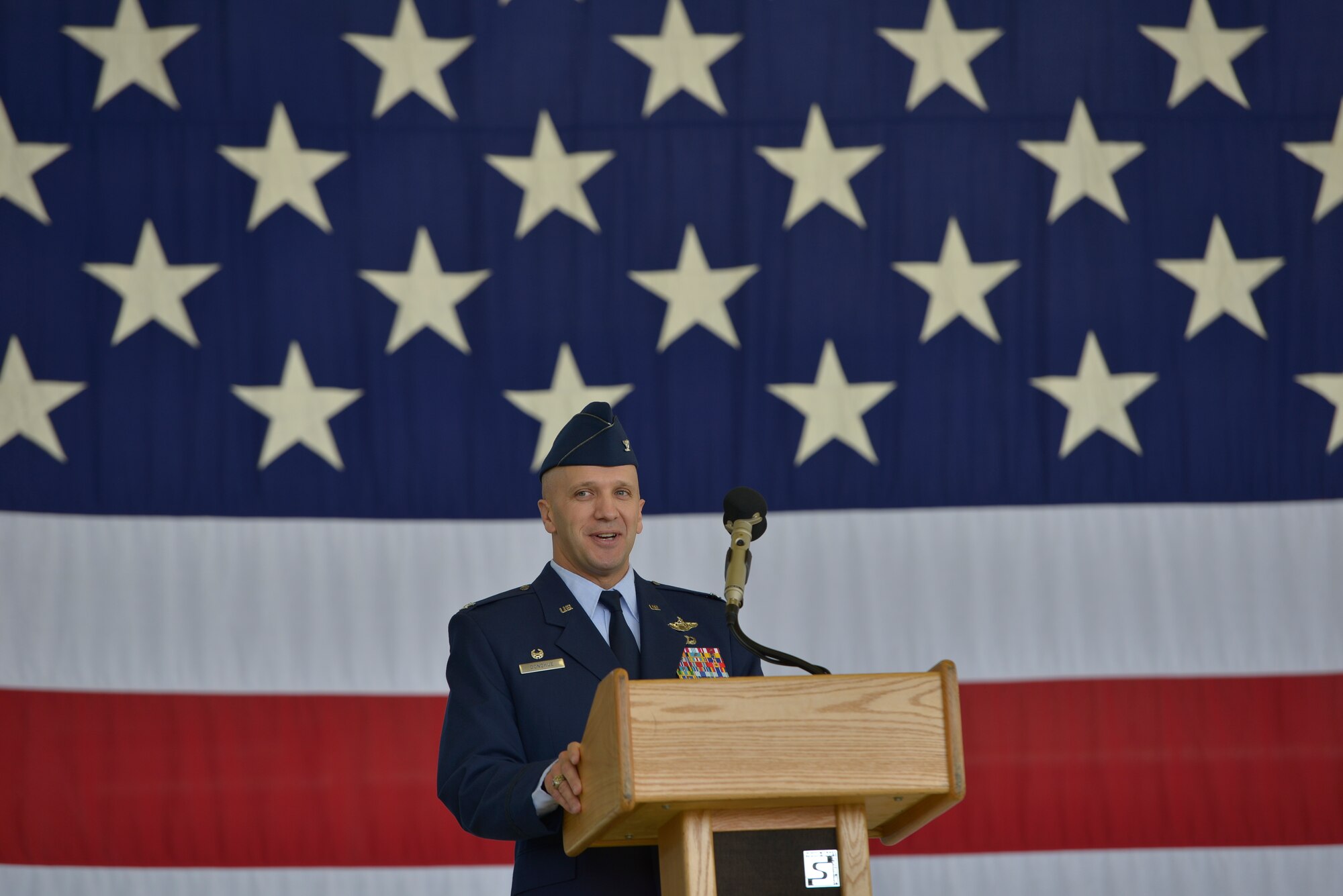 Col. Gerald A. Donohue, 86th Operations Group commander, gives his speech after accepting command during the 86th OG change of command Aug. 5, 2015, at Ramstein Air Base, Germany. Donohue assumed command from Col. Ashley D. Salter to continue supporting the 86th Airlift Wing’s mission by providing full spectrum airlift operations. (U.S. Air Force photo/Airman 1st Class Lane T. Plummer) 
