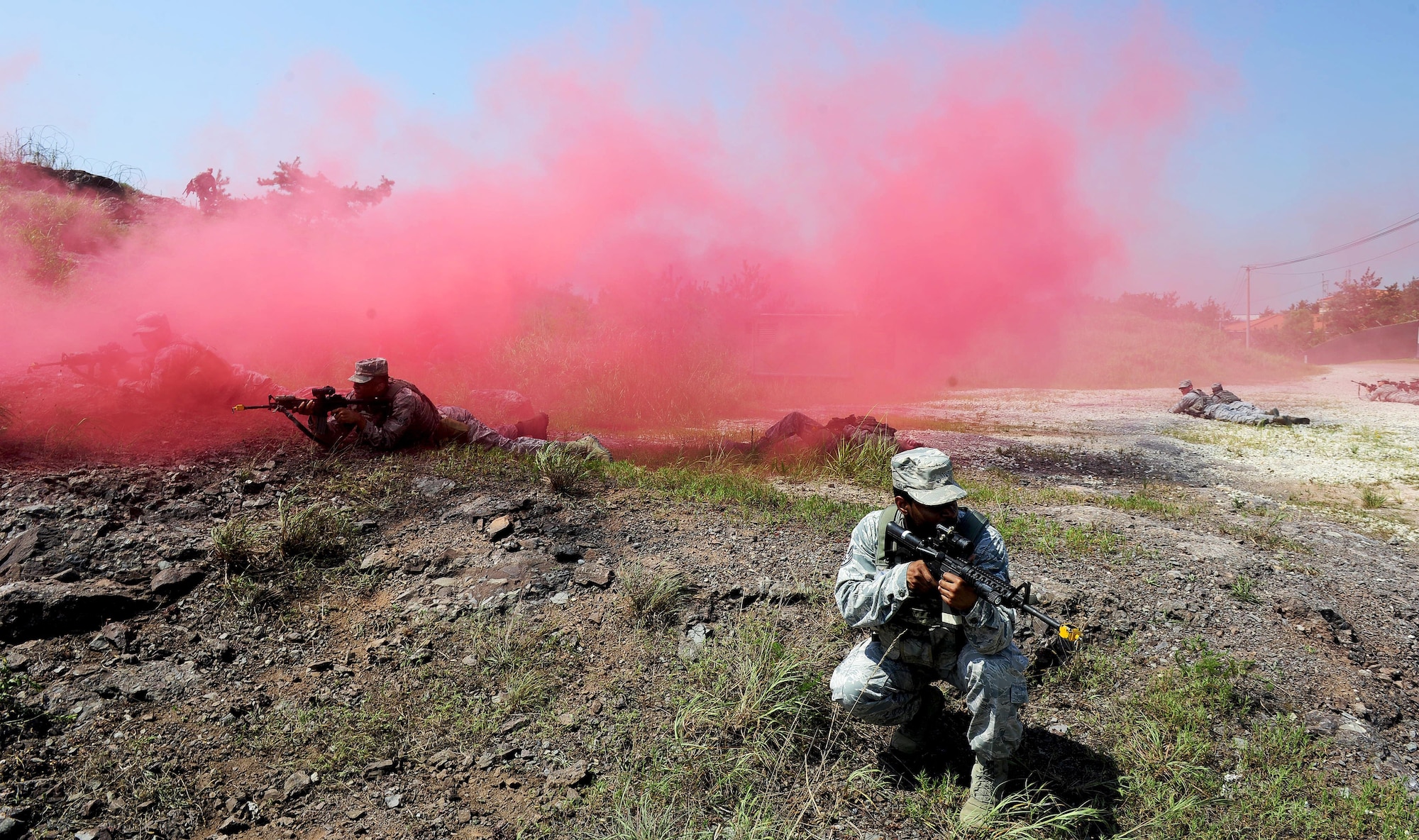 Airmen from the 8th Security Forces Squadron participate in a tactical combat casualty care scenario during a three day combat readiness training exercise at Kunsan Air Base, Republic of Korea, August 3, 2015. Integrating Airmen of all ranks with Republic of Korea air force members in quarterly CRTs strengthens teamwork to provide a higher level of safety and security of the Wolf Pack. (U.S. Air Force photo by Staff Sgt. Nick Wilson/Released)