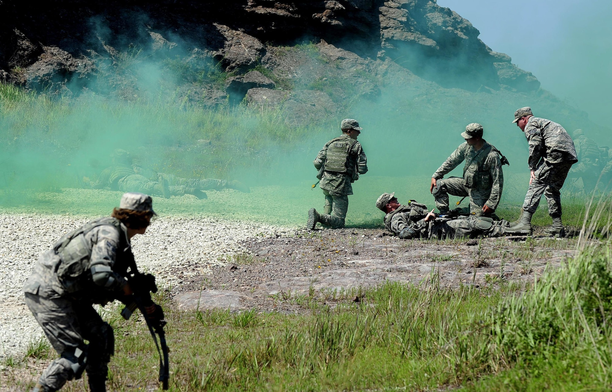 Airmen from the 8th Security Forces Squadron provide care under fire during a tactical combat casualty care scenario, which was part of a three day combat readiness training exercise at Kunsan Air Base, Republic of Korea, August 3, 2015. As Kunsan’s first line of defense, security forces members must accurately and effectively perform their tactical capabilities to defend against threats. (U.S. Air Force photo by Staff Sgt. Nick Wilson/Released)
