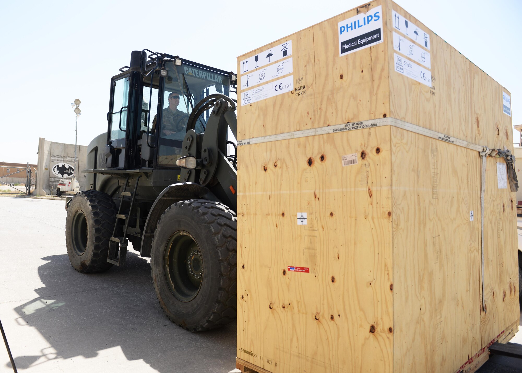A member of the Craig Joint Theater Hospital staff drives in the new computerized tomography scanner to be used in the radiology department June 27, 2015, at Bagram Airfield, Afghanistan. The new machine, which replaces an old 2006 model, has more high tech special feature that the other machine lacked such as a one third lower radiation dose with higher image quality, faster reconstructions, faster scanner times and the ability to move more patients during a mass casualty. (U.S. Air Force photo by Senior Airman Cierra Presentado/Released)