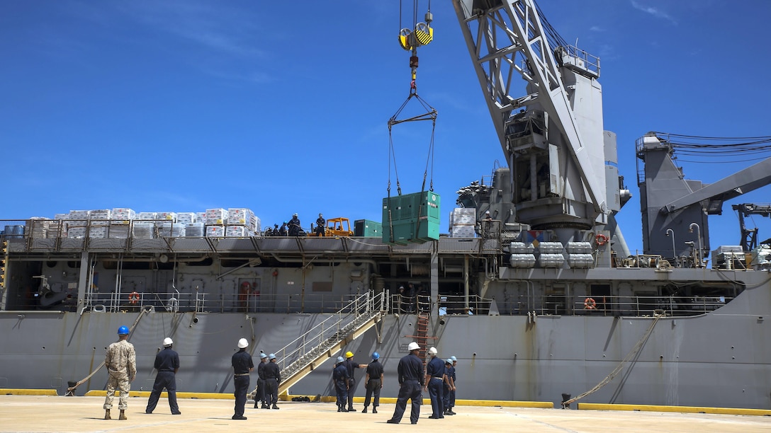 U.S. Marines and sailors with the 31st Marine Expeditionary Unit and the USS Ashland offload relief supplies from the ship for typhoon recovery efforts in Saipan, Aug. 8, 2015. The MEU and the ships of the Bonhomme Richard Amphibious Ready Group will assist the Federal Emergency Management Agency in delivering the supplies to the victims of Typhoon Soudelor in Saipan. The island, part of the Commonwealth of the Northern Mariana Islands, was struck by the typhoon Aug. 2-3.