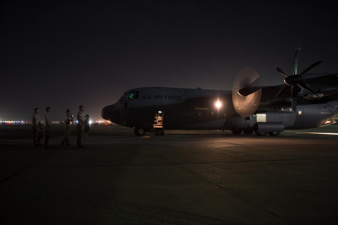 U.S. Airmen assigned to the 455th Expeditionary Aircraft Maintenance Squadron, perform preflight checks on a C-130J Super Hercules aircraft on the flight line at Bagram Airfield, Afghanistan, Aug. 7, 2015.  The 455th EAMXS ensure Super Hercules on Bagram are prepared for flight and return them to a mission-ready state once they land. (U.S. Air Force photo by Tech. Sgt. Joseph Swafford/Released) 