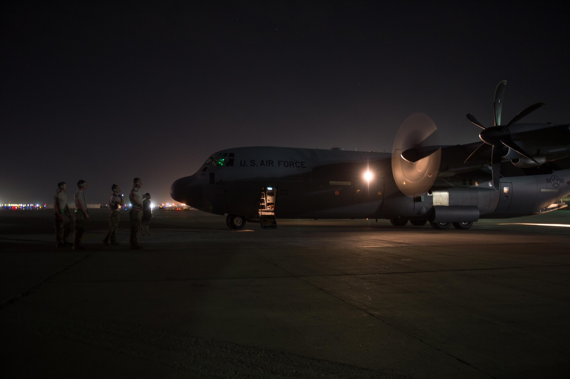 U.S. Airmen assigned to the 455th Expeditionary Aircraft Maintenance Squadron, perform preflight checks on a C-130J Super Hercules aircraft on the flight line at Bagram Airfield, Afghanistan, Aug. 7, 2015.  The 455th EAMXS ensure Super Hercules on Bagram are prepared for flight and return them to a mission-ready state once they land. (U.S. Air Force photo by Tech. Sgt. Joseph Swafford/Released) 