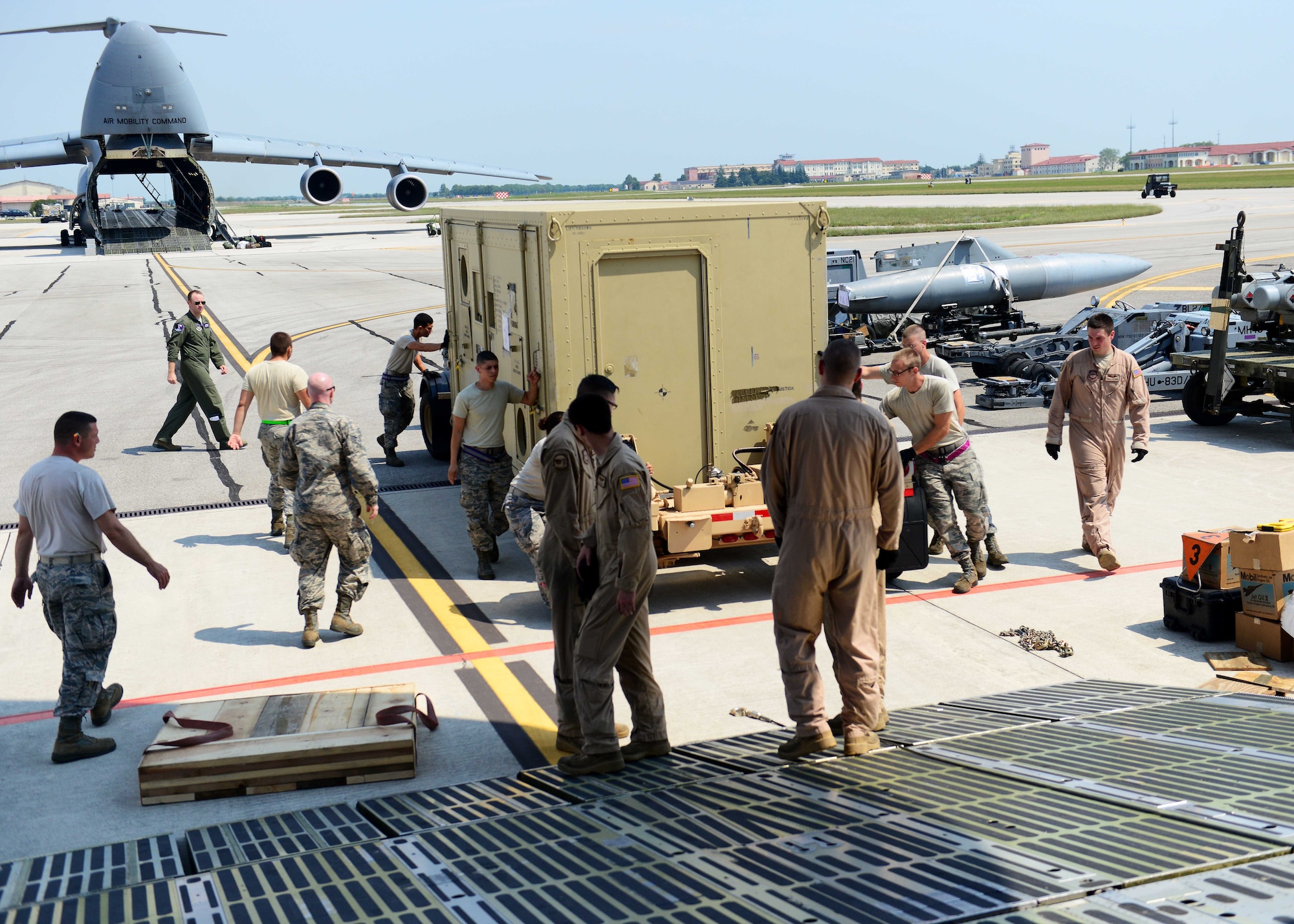Airmen from the 436th Airlift Wing and 724th Air Mobility Squadron load cargo onto a C-5 Super Galaxy in support of Operation Inherent Resolve Aug. 8, 2015, at Aviano Air Base, Italy. This deployment coincides with Turkey's decision to host U.S. aircraft to conduct counter-ISIL operations. (U.S. Air Force photo by Airman 1st Class Deana Heitzman)