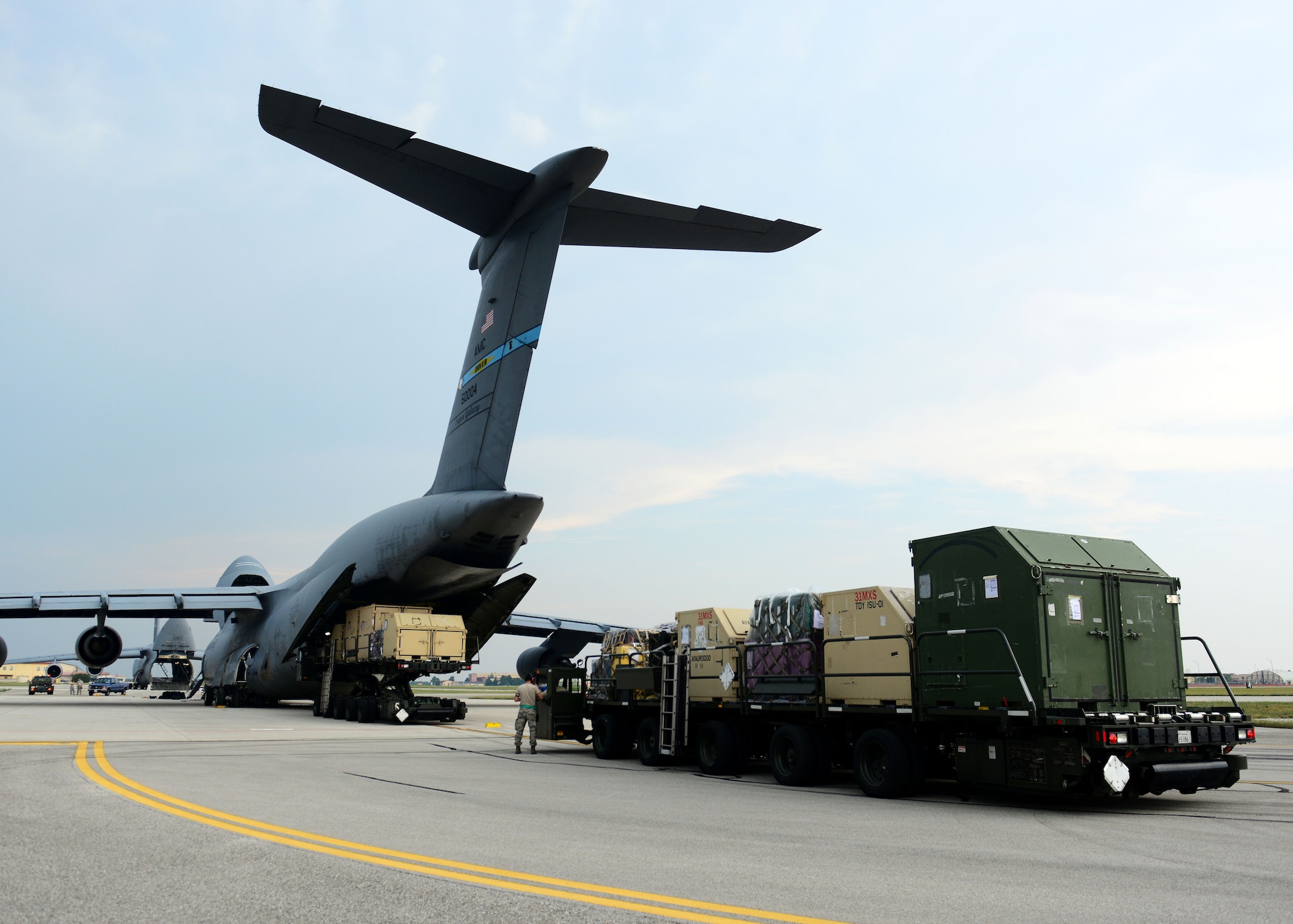 Cargo is loaded onto a C-5 Super Galaxy from the 436th Airlift Wing Aug. 8, 2015, at Aviano Air Base, Italy. The cargo will be delivered to Incirlik Air Base, Turkey, in support of Operation Inherent Resolve. This deployment coincides with Turkey's decision to host U.S. aircraft to conduct counter-ISIL operations. (U.S. Air Force photo by Airman 1st Class Deana Heitzman)