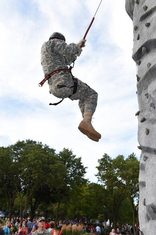 Sgt. 1st Class David Fittanto, 85th Support Command, rappels from the Chicago Recruiting Battalion’s rock climbing wall during the Arlington Heights Police Department’s National Night Out (NNO) community event, Aug. 4. The annual community event, which connects the local community with law enforcement and first responders, brought in an estimated 4000 in attendance. Soldiers also from the 327th Military Police Battalion participated, simultaneously, in another NNO at the Village of Rolling Meadows.
(U.S. Army photo by Sgt. Aaron Berogan/Released)