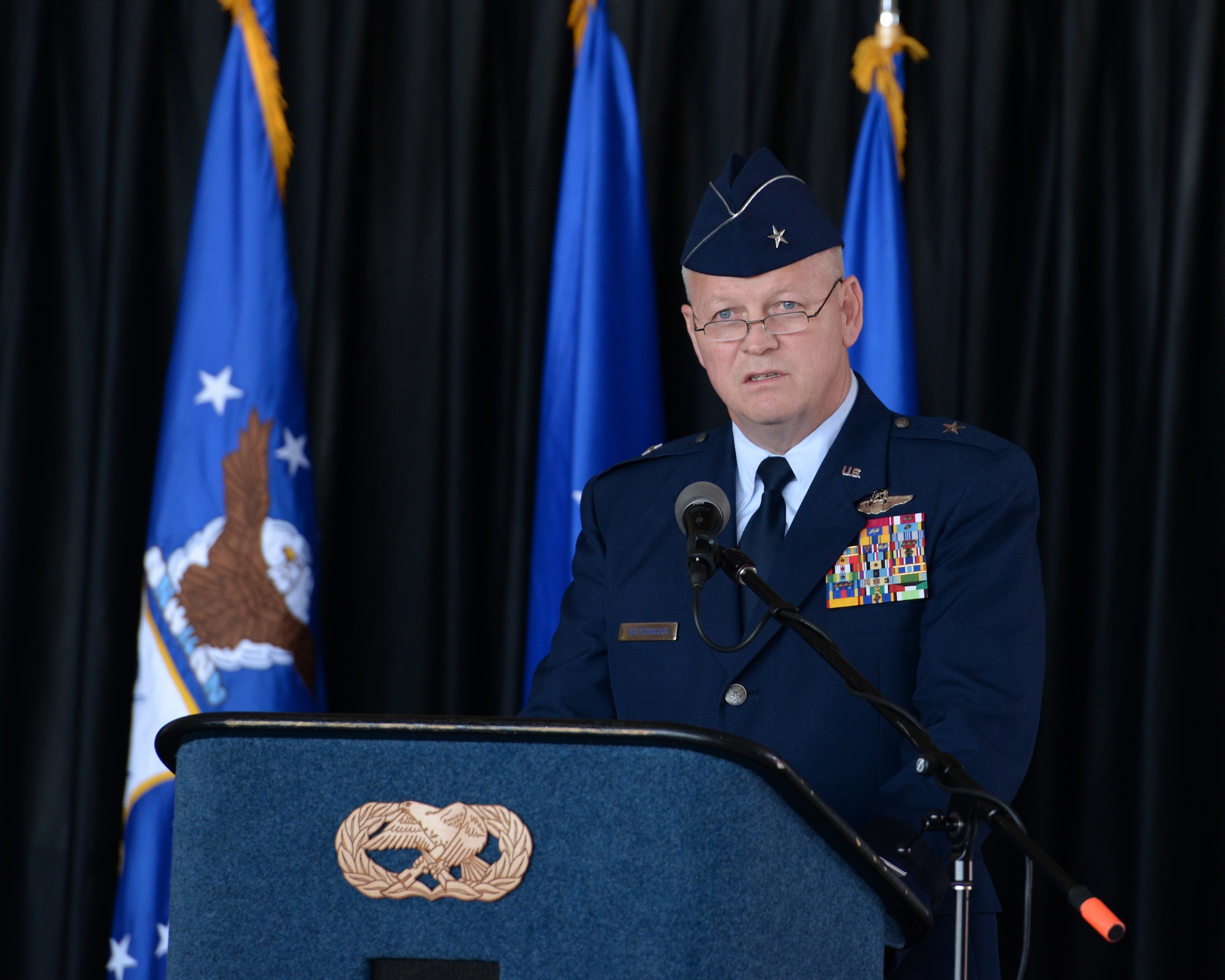 Brig. Gen. Paul Hutchinson, commander New Hampshire Air National Guard speaks to the audience during a change of command ceremony at Pease Air National Base, N.H., on Aug. 9, 2015. Hutchinson assumed command of the NHANG from Brig. Gen. Carolyn J. Protzmann. (U.S. Air National Guard photo by Staff Sgt. Curtis J. Lenz)