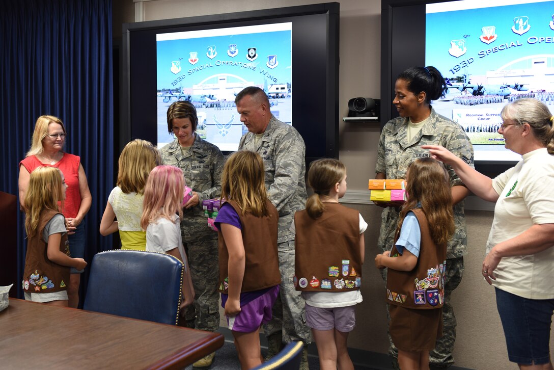 Girl Scout Brownie Troop 11062 donates Girl Scout Cookies to the 193rd Special Operations Wing, Middletown, Pennsylvania on July 11. Many of their customers purchased and donated boxes of cookies to support troops here and overseas.(U.S. Air National Guard photo by Airman Julia Sorber/Released)