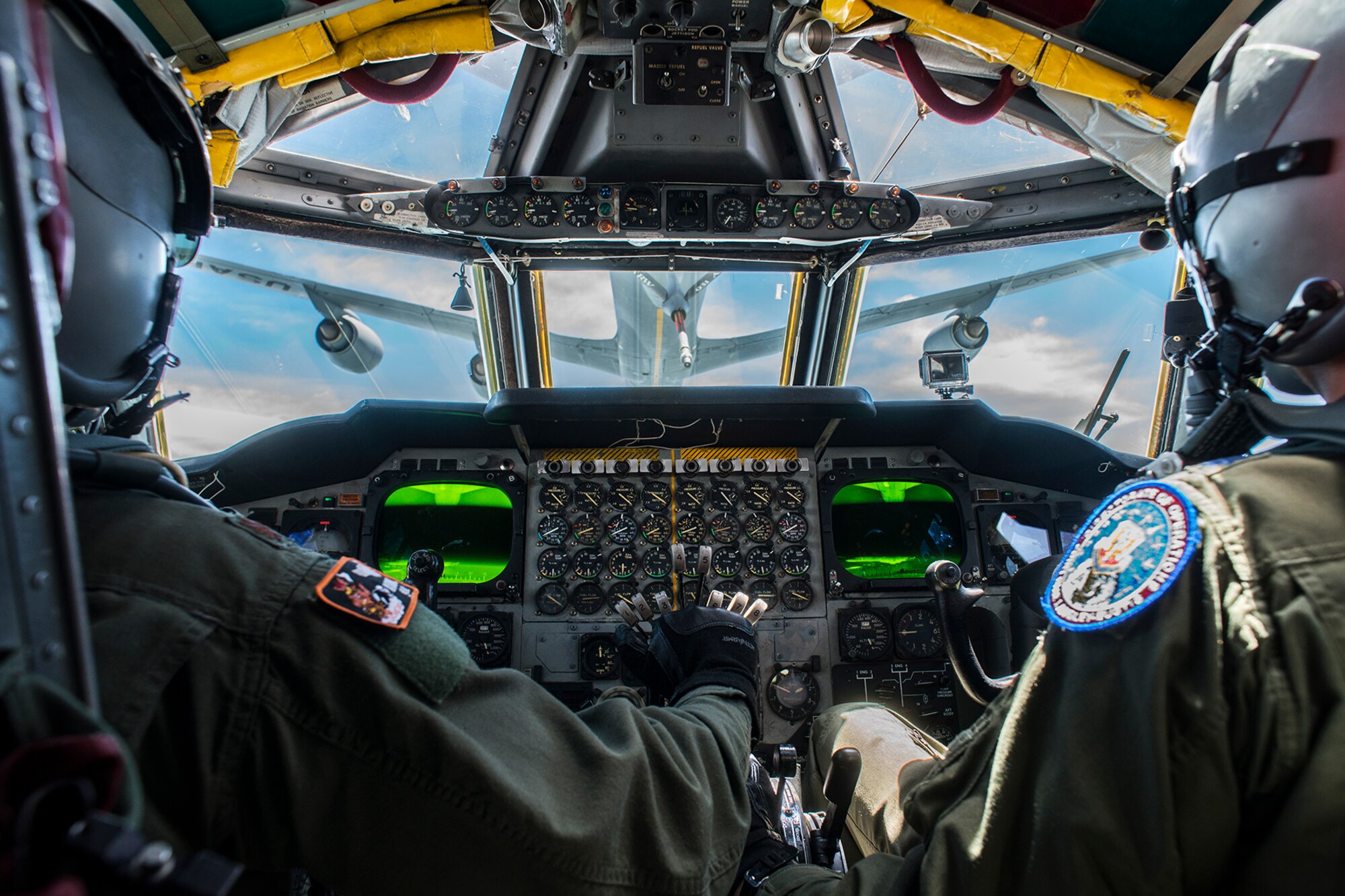 A B-52H Stratofortress pilot and copilot practice an aerial refueling with a KC-135 Stratotanker over Barksdale Air Force Base, Louisiana. The B-52 is assigned to the Air Force Reserve Command's 307th Bomb Wing, which hosts the only schoolhouse where Reserve and Active Duty aircrew learn to fly the B-52. (U.S. Air Force photo by Master Sgt. Greg Steele/Released)