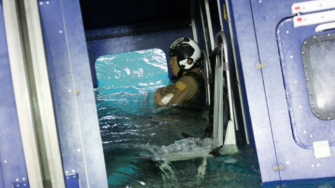 Lance Cpl. Eun Lee participates in water survival training at Marine Corps Air Station Cherry Point, North Carolina, July 28, 2015. The Aviation Survival Training Center is the only water survival facility on any Marine Corps installation on the East Coast. Naval aviators are given classes on protocol and the gear they use in case of an emergency on an aircraft. The skills they learn in ASTC ensure 2nd Marine Aircraft Wing, its aviators and crew members are qualified and maintain the highest state of readiness. Lee is is an airframe mechanic with Marine Heavy Helicopter Squadron 366.