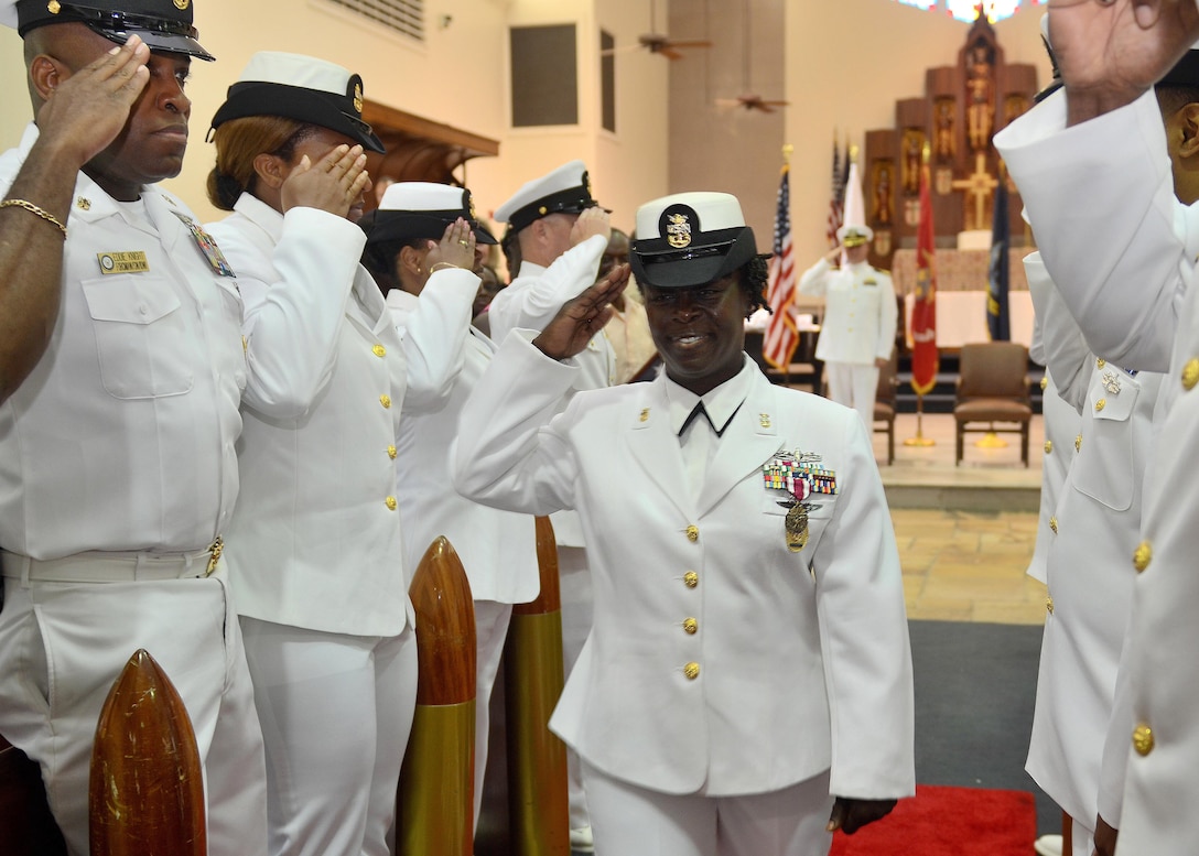 Naval Hospital Jacksonville Command Master Chief Bennora Simmons is piped ashore for the last time following her retirement ceremony at All Saints Chapel aboard Naval Air Station Jacksonville, Fla. Simmons is retiring after 30 years of naval service. 