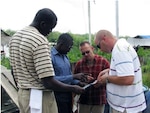 Mr. Mbakhana, a Guyana Defense Force sailor, along with Missouri National Guard Soldier’s Capt. Aaron Larimore, and Staff Sgt. Michael Blomberg review river routes and communication short falls with the Guyana Defense Force’s current equipment.