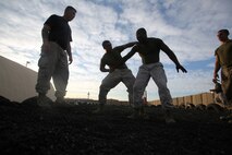 Marines with 1st Marine Regiment, 1st Marine Division, practice martial art techniques on an early morning at Camp Wilson aboard Marine Corps Ground Air Combat Center Twentynine Palms, Calif., Aug. 7, 2015. While the Marines are here for various training exercises, they use their limited off time to improve themselves in the Marine Corps Martial Arts Program and ensure they are prepared for anything that may come their way.