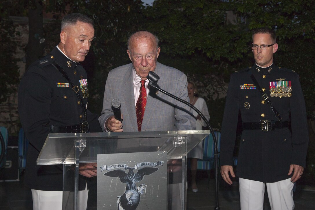 The Honorable George P. Shultz, the 60th United States Secretary of State, speaks to guests attending an evening parade reception at Marine Barracks Washington, D.C., Aug. 7, 2015. The Honorable George P. Shultz was the guest of honor for the parade, and U.S. Marine Corps Gen. Joseph F. Dunford Jr., 36th commandant of the Marine Corps, was the hosting official. The Evening Parade summer tradition began in 1934 and features the Silent Drill Platoon, the U.S. Marine Band, the U.S. Marine Drum and Bugle Corps and two marching companies. More than 3,500 guests attend the parade every week. (U.S. Marine Corps photo by Lance Cpl. Kayla V. McTaw/Released)