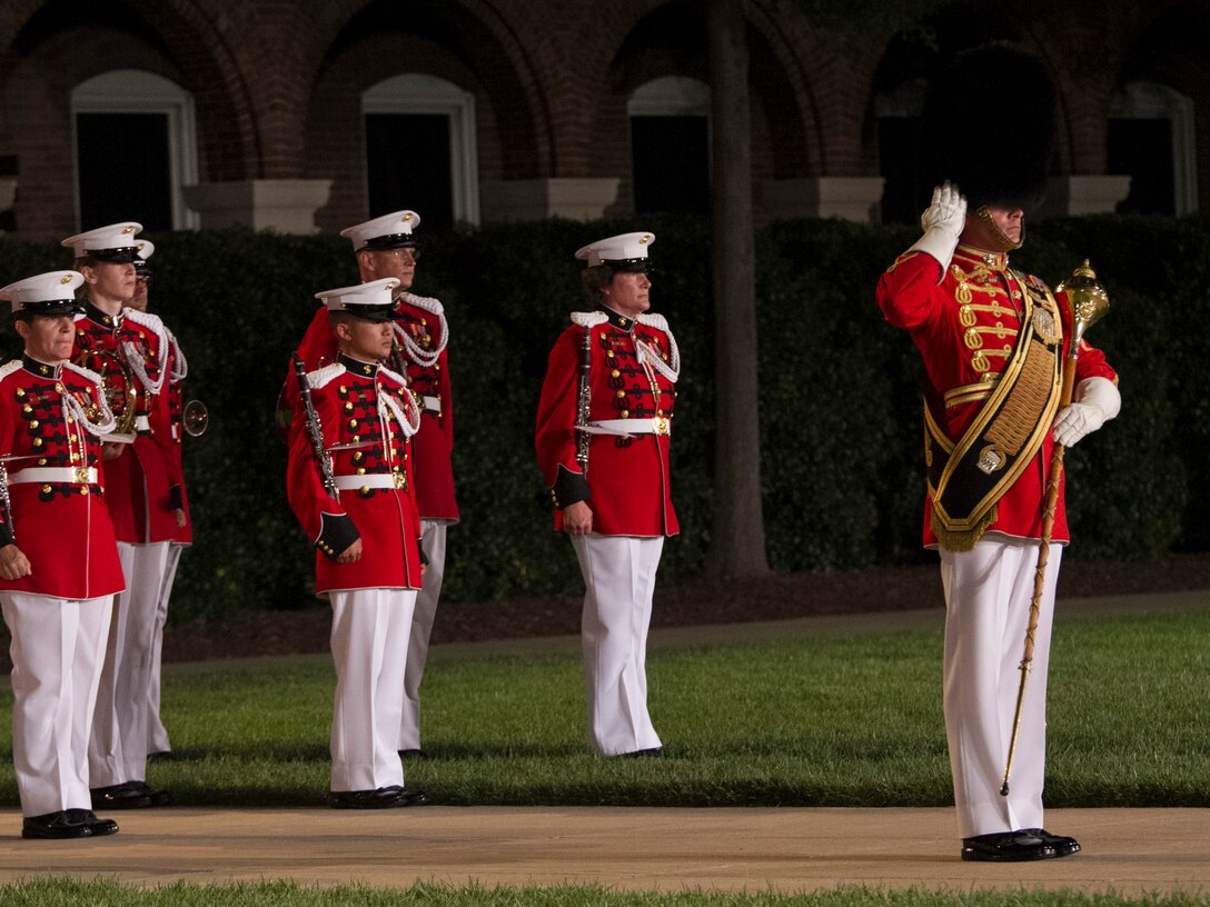 The United States Marine Band performs during an Evening Parade at Marine Barracks Washington, D.C., Aug. 7, 2015. The hosting official for the parade was Gen. Joseph F. Dunford Jr., commandant of the Marine Corps, the guest of honor was The Honorable George P. Shultz, the 60th United States Secretary of State. (U.S. Marine Corps photo by Cpl. Skye Davis/Released) 