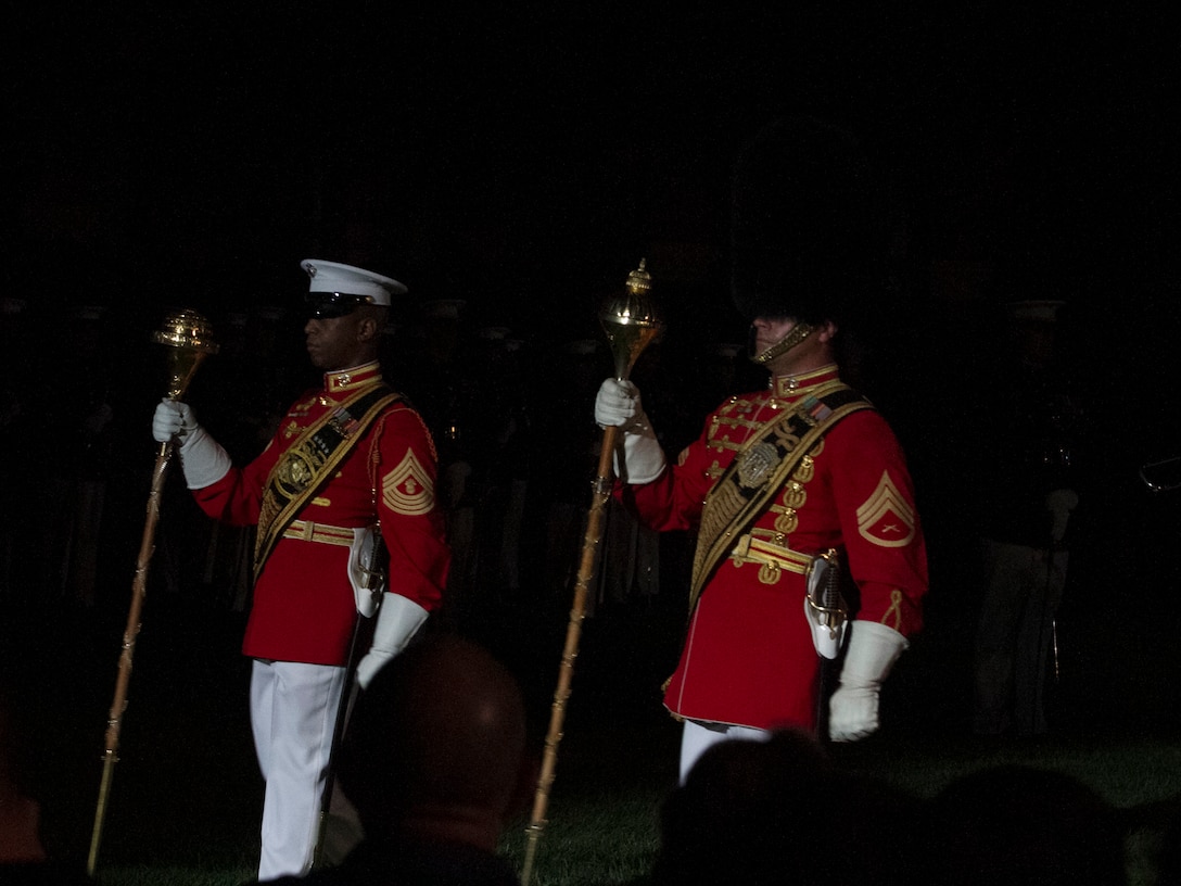 The United States Marine Band and the United States Marine Drum and Bugle Corps perform during an Evening Parade at Marine Barracks Washington, D.C., Aug. 7, 2015. The hosting official for the parade was Gen. Joseph F. Dunford Jr., commandant of the Marine Corps, the guest of honor was The Honorable George P. Shultz, the 60th United States Secretary of State. (U.S. Marine Corps photo by Cpl. Skye Davis/Released) 