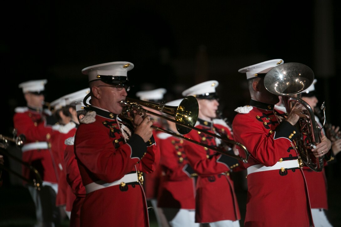 The United States Marine Band performs during an Evening Parade at Marine Barracks Washington, D.C., Aug. 7, 2015. The hosting official for the parade was Gen. Joseph F. Dunford Jr., commandant of the Marine Corps, the guest of honor was The Honorable George P. Shultz, the 60th United States Secretary of State. (U.S. Marine Corps photo by Cpl. Christian Varney/Released) 