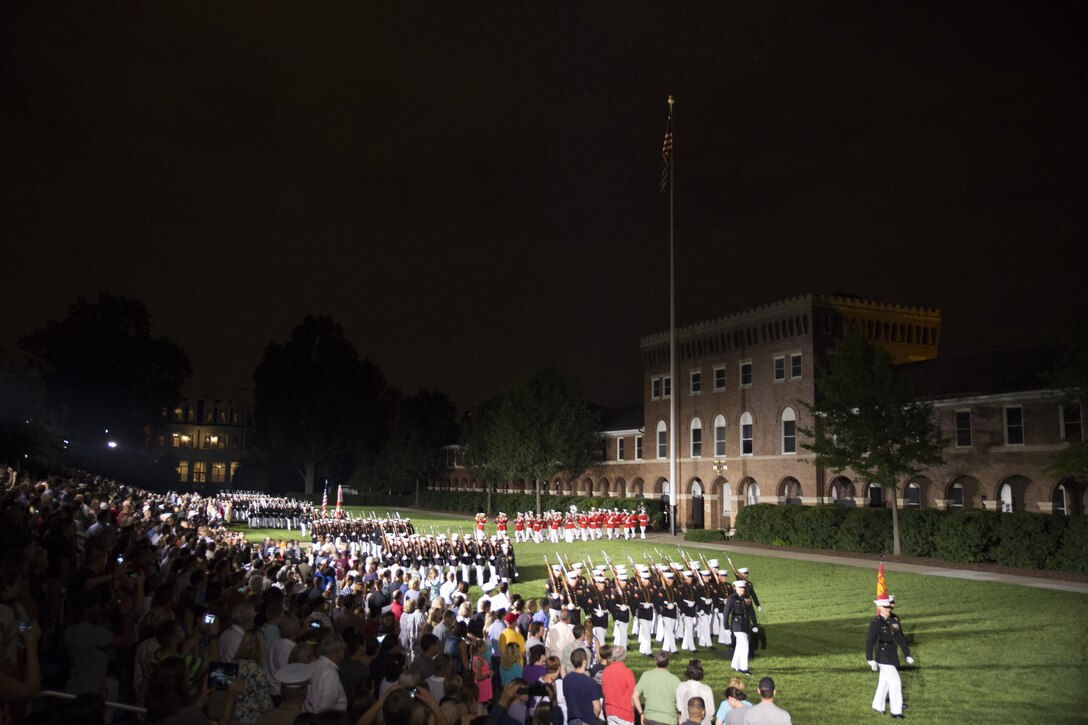 Marines from Marine Barracks Washington, D.C., perform during an Evening Parade at Marine Barracks Washington, D.C., Aug. 7, 2015. The hosting official for the parade was Gen. Joseph F. Dunford Jr., commandant of the Marine Corps, the guest of honor was The Honorable George P. Shultz, the 60th United States Secretary of State. (U.S. Marine Corps photo by Cpl. Chi Nguyen/Released)