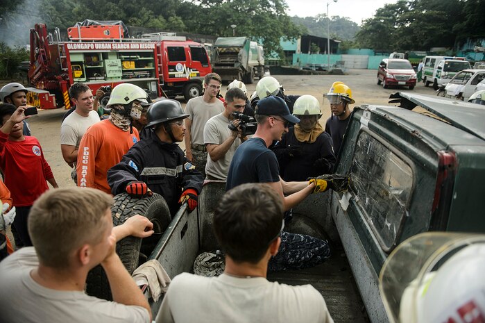 OLONGAPO, Philippines (Aug. 6, 2015) - Soldiers from the 84th Civil Affairs Battalion and Sailors assigned to the hospital ship USNS Mercy (T-AH 19) train in urban search and rescue techniques with the Olongapo Urban Search and Rescue team during Pacific Partnership 2015. Mercy is currently in the Philippines for its third mission port of PP15. Pacific Partnership is in its 10th iteration and is the largest annual multilateral humanitarian assistance and disaster relief preparedness mission conducted in the Indo-Asia-Pacific region. While training for crisis conditions, Pacific Partnership missions to date have provided real world medical care to approximately 270,000 patients and veterinary services to more than 38,999 animals. Additionally, the mission has provided critical infrastructure development to host nations through more than 180 engineering projects. 