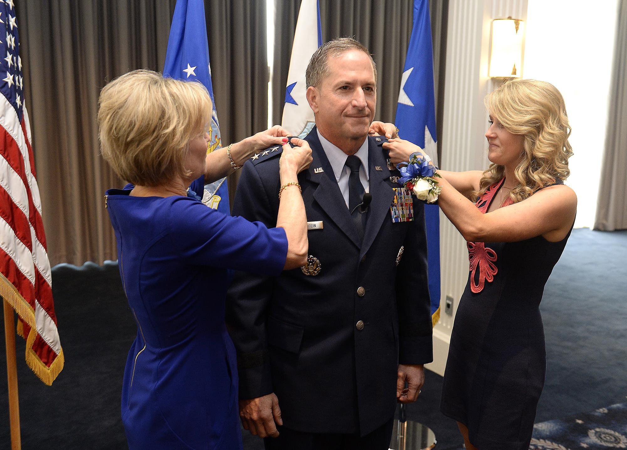 The rank of general is pinned on Gen. David L. Goldfein by his wife, Dawn, and daughter, Diana Glass, during his promotion ceremony Aug. 6, 2015, in Washington, D.C. Goldfein's promotion makes him the Air Force's 38th vice chief of staff. (U.S. Air Force photo/Scott M. Ash)