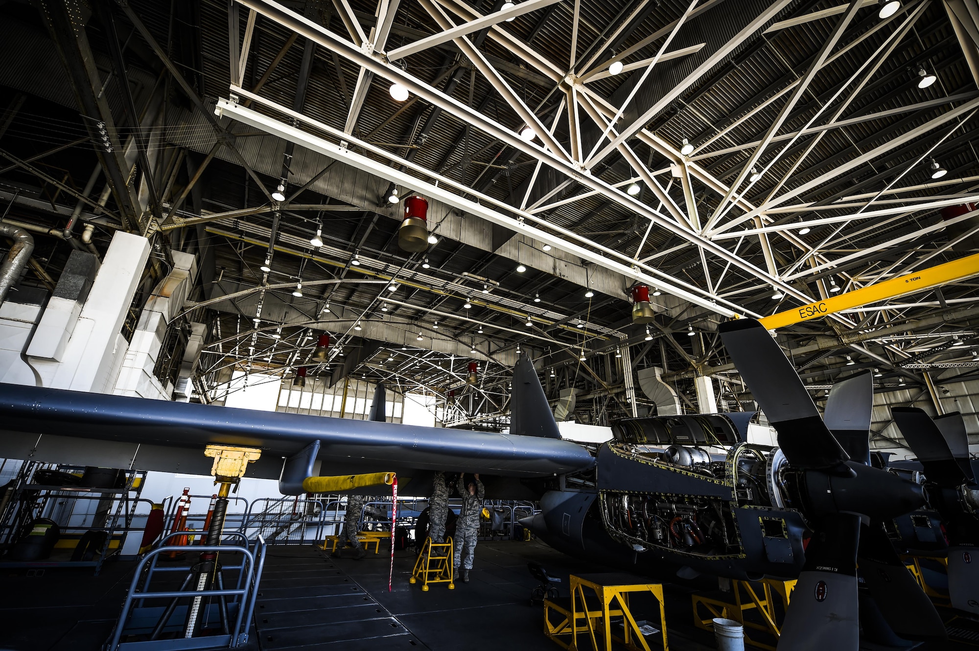 Airmen with the 1st Special Operations Equipment Maintenance Squadron non-destructive inspection flight examine a C-130 wing at the Eason Hangar on Hurlburt Field, Fla., July 20, 2015. Airmen inspect multiple locations of the aircraft, checking for flaws and cracks that could be dangerous if left undetected. (U.S. Air Force photo by Senior Airman Christopher Callaway)