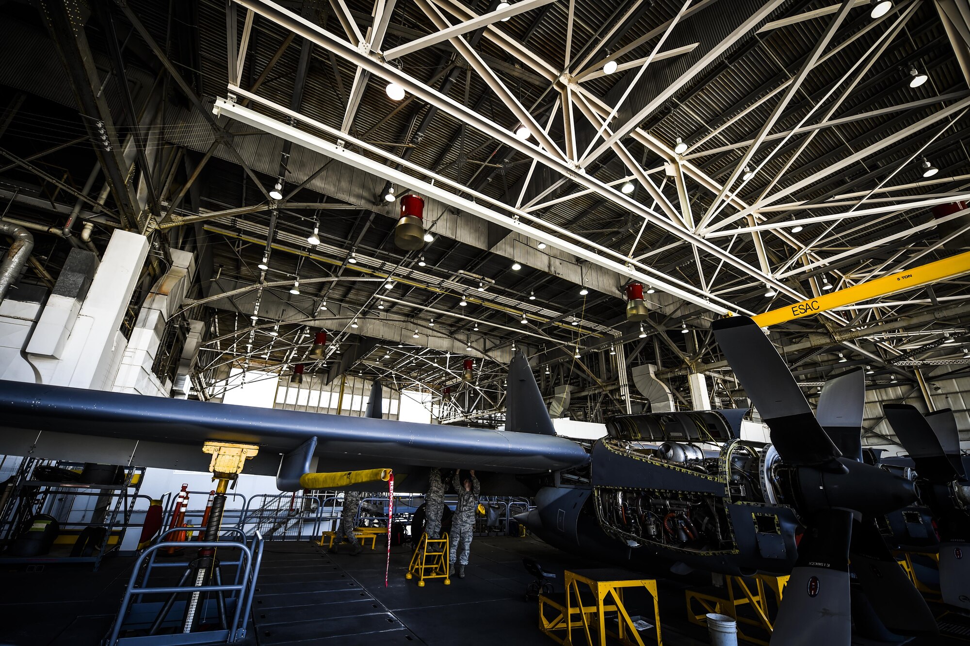 Airmen with the 1st Special Operations Equipment Maintenance Squadron non-destructive inspection flight examine a C-130 wing at the Eason Hangar on Hurlburt Field, Fla., July 20, 2015. Airmen inspect multiple locations of the aircraft, checking for flaws and cracks that could be dangerous if left undetected. (U.S. Air Force photo by Senior Airman Christopher Callaway)