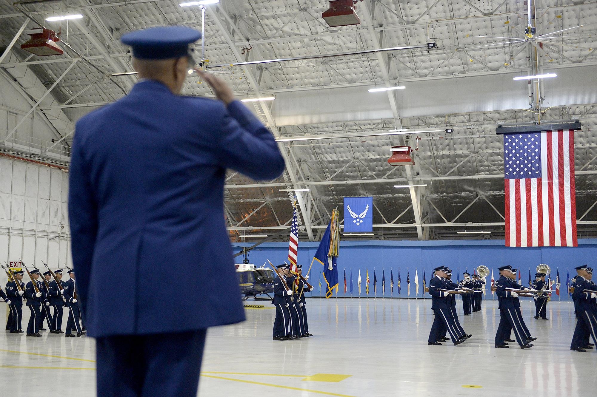 Air Force Vice Chief of Staff Gen. Larry O. Spencer salutes during a pass in review procession at his retirement ceremony at Joint Base Andrews, Md., Aug. 7, 2015. Spencer enlisted into the Air Force in 1971 and was commissioned as a second lieutenant Feb. 14, 1980. (U.S. Air Force photo/Scott M. Ash)  