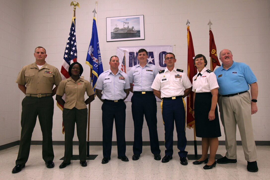 Honorees and their nominators gather for a photograph following the Service Person of the Quarter luncheon ceremony in Morehead City, North Carolina, Aug. 7, 2015. The Havelock Chamber of Commerce awarded Lance Cpl. Lacey L. Dauphine, second from left, as the Service Person of the Quarter along with two other outstanding service members for their constant dedication to duty and their community. Dauphine is an administrative specialist with Headquarters and Headquarters Squadron.