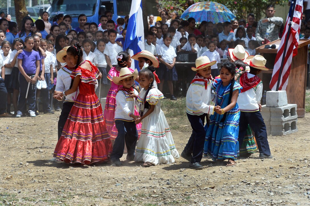 Gabriela Mistral students perform a traditional dance during the ribbon-cutting ceremony at the Gabriela Mistral school in Ocotes Alto, Honduras, July 28, 2015. 