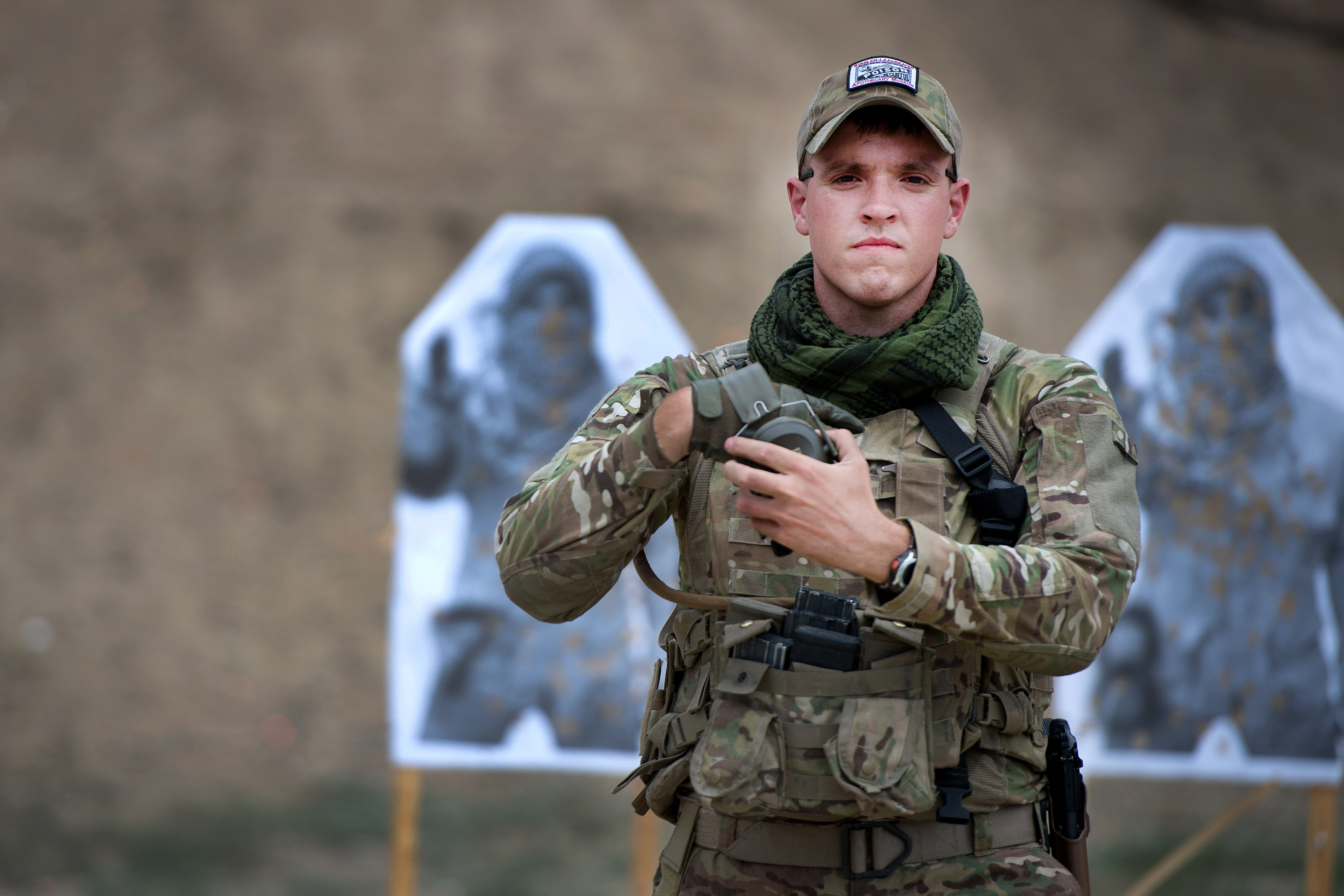 U S Army Cpl George Huley Walks From A Range To Load Ammunition 