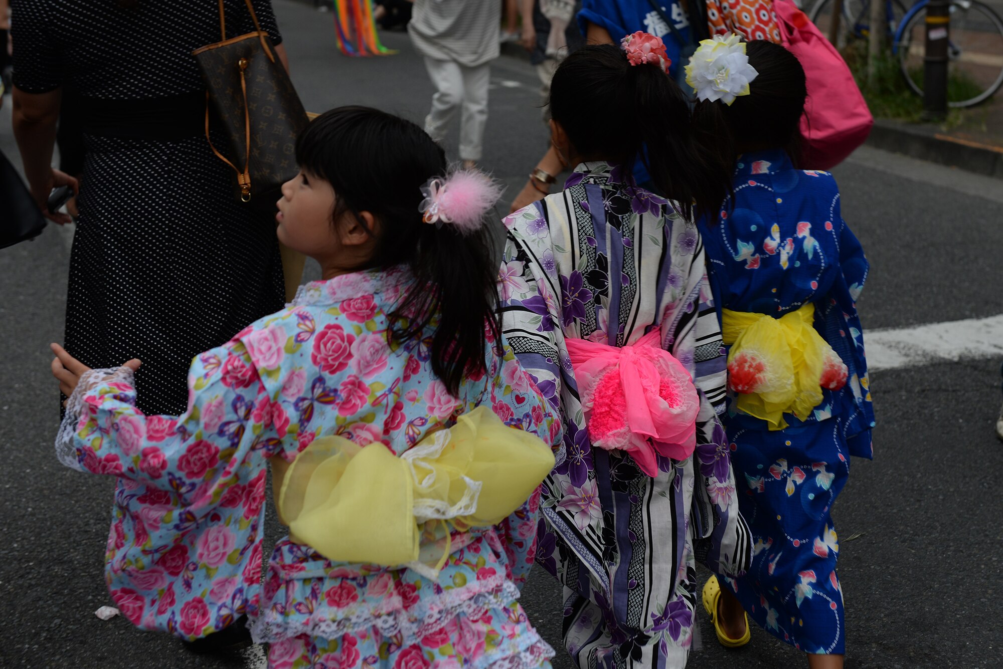Children wear traditional kimonos as part of a parade during the Tanabata Festival in Fussa City, Japan, Aug. 7, 2015. The festival included several parades as well as street vendors selling a variety of traditional Japanese festival foods. (U.S. Air Force photo by Airman 1st Class Elizabeth Baker/Released)