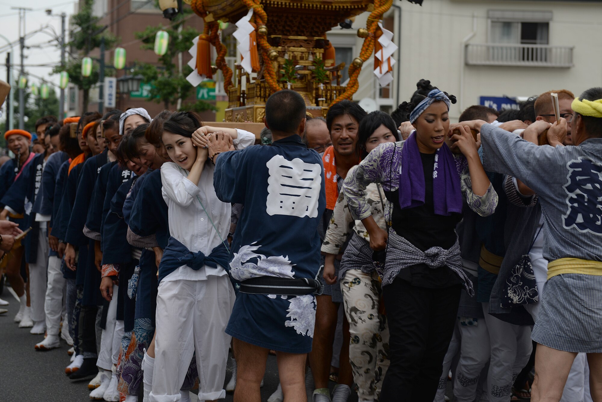 Local residents carry a mikoshi shrine in Fussa City, Japan, Aug. 7, 2015, during the 65th annual Fussa Tanabata Festival. The festival included traditional Japanese dance performances and groups carrying mikoshi shrines to the City Hall. (U.S. Air Force photo by Airman 1st Class Elizabeth Baker/Released)