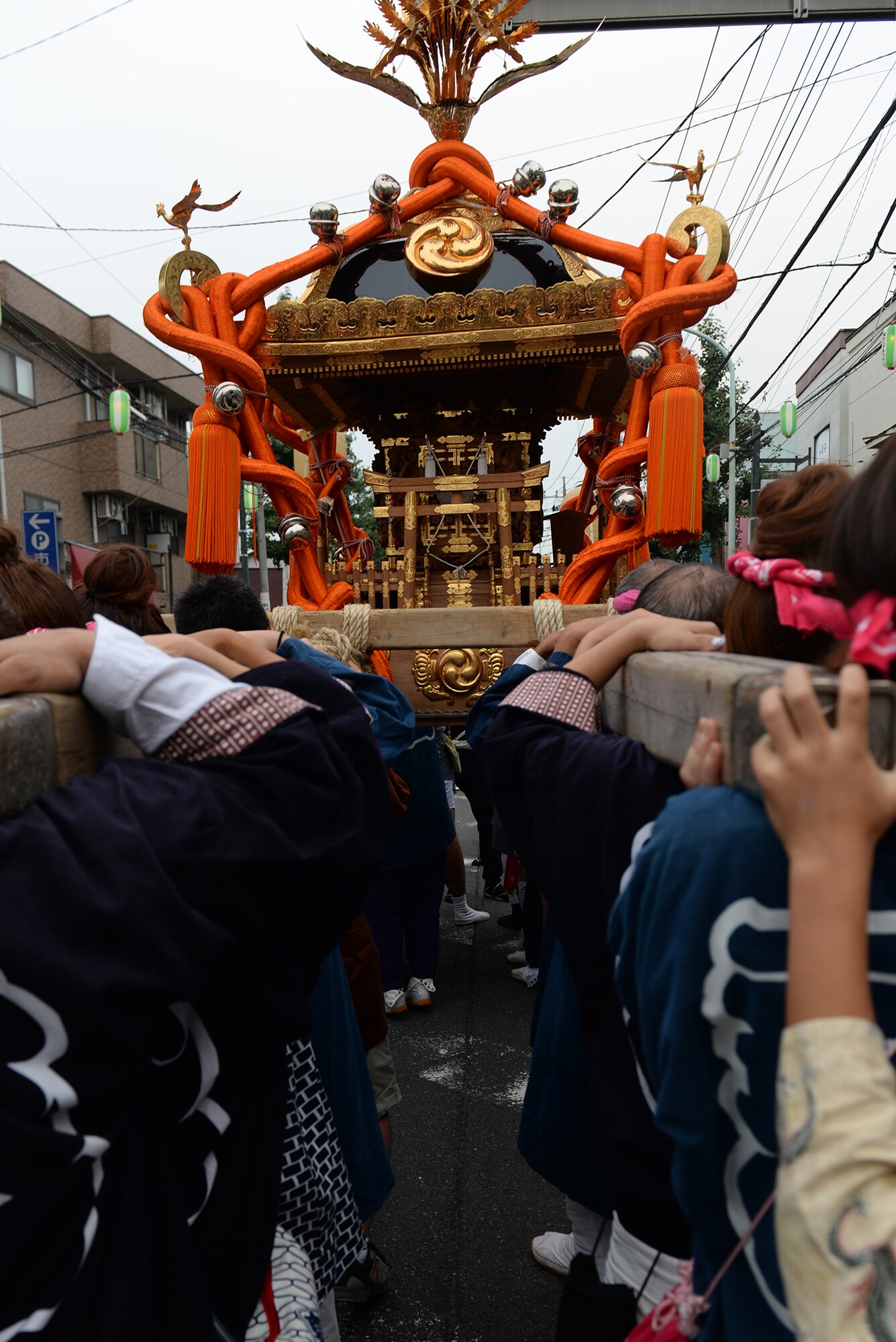 Local residents carry a mikoshi shrine in Fussa City, Japan, Aug. 7, 2015, during the 65th annual Fussa Tanabata Festival. The festival included traditional Japanese dance performances and groups carrying mikoshi shrines to the City Hall. (U.S. Air Force photo by Airman 1st Class Elizabeth Baker/Released)