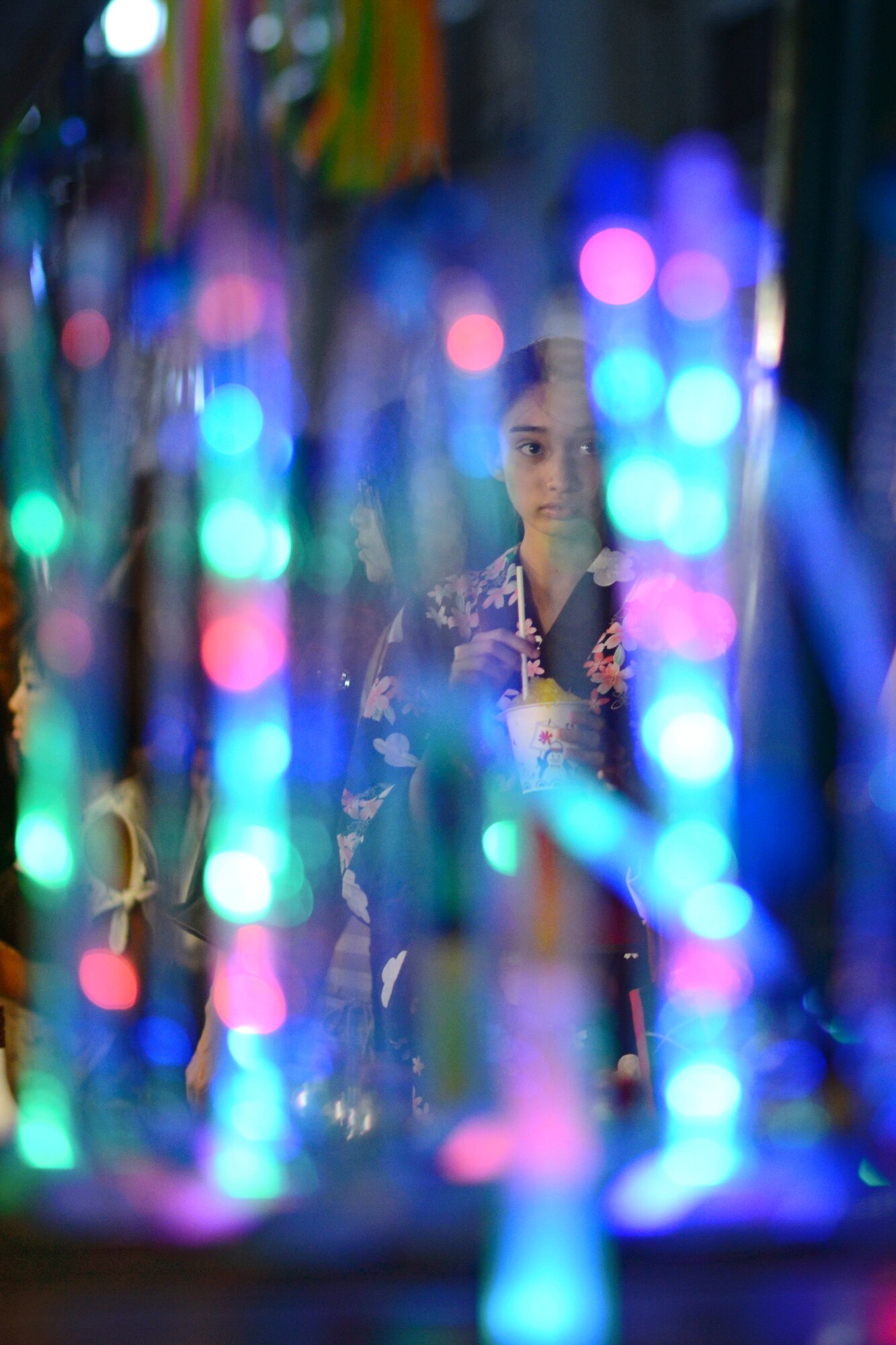 A festival attendee takes in sights and sounds of the Tanabata Festival, Aug. 8, 2015, in Fussa City, Japan. This year marked the 65th annual Tanabata Festival in Fussa, attracting people from all over the surrounding area.  (U.S. Air Force photo by Airman 1st Class Delano Scott/Released)