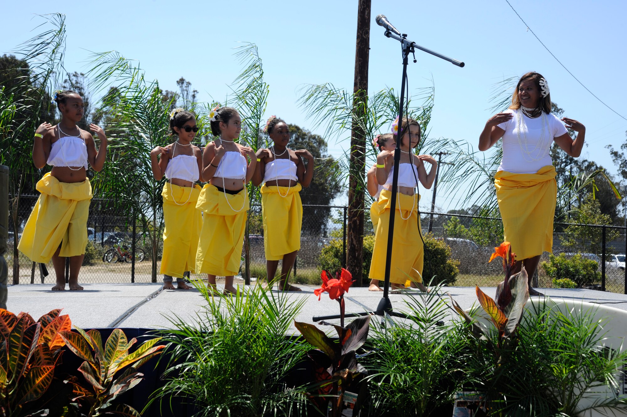 The Vandenberg Youth Center Hula Dance Club performs at the Salute to Youth event, Aug. 7, 2015, Vandenberg Air Force Base, Calif. The Salute to Youth program is an opportunity for families of Team V, including families with special needs and school-aged children, to become familiarized with educational opportunities and resources for their children. (U.S. Air Force photo by Airman 1st Class Robert J. Volio/Released)