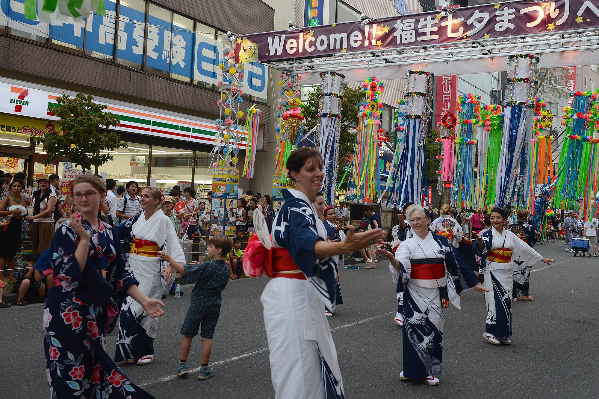 Yokota's Tanabata Dancers participate in a parade during the Tanabata Festival in Fussa City, Japan, Aug. 7, 2015. The group was established in 1973 to promote goodwill and friendship with the Japanese by learning traditional dances and joining in Japanese festivals.. (U.S. Air Force photo by Senior Airman David C. Danford/Released)